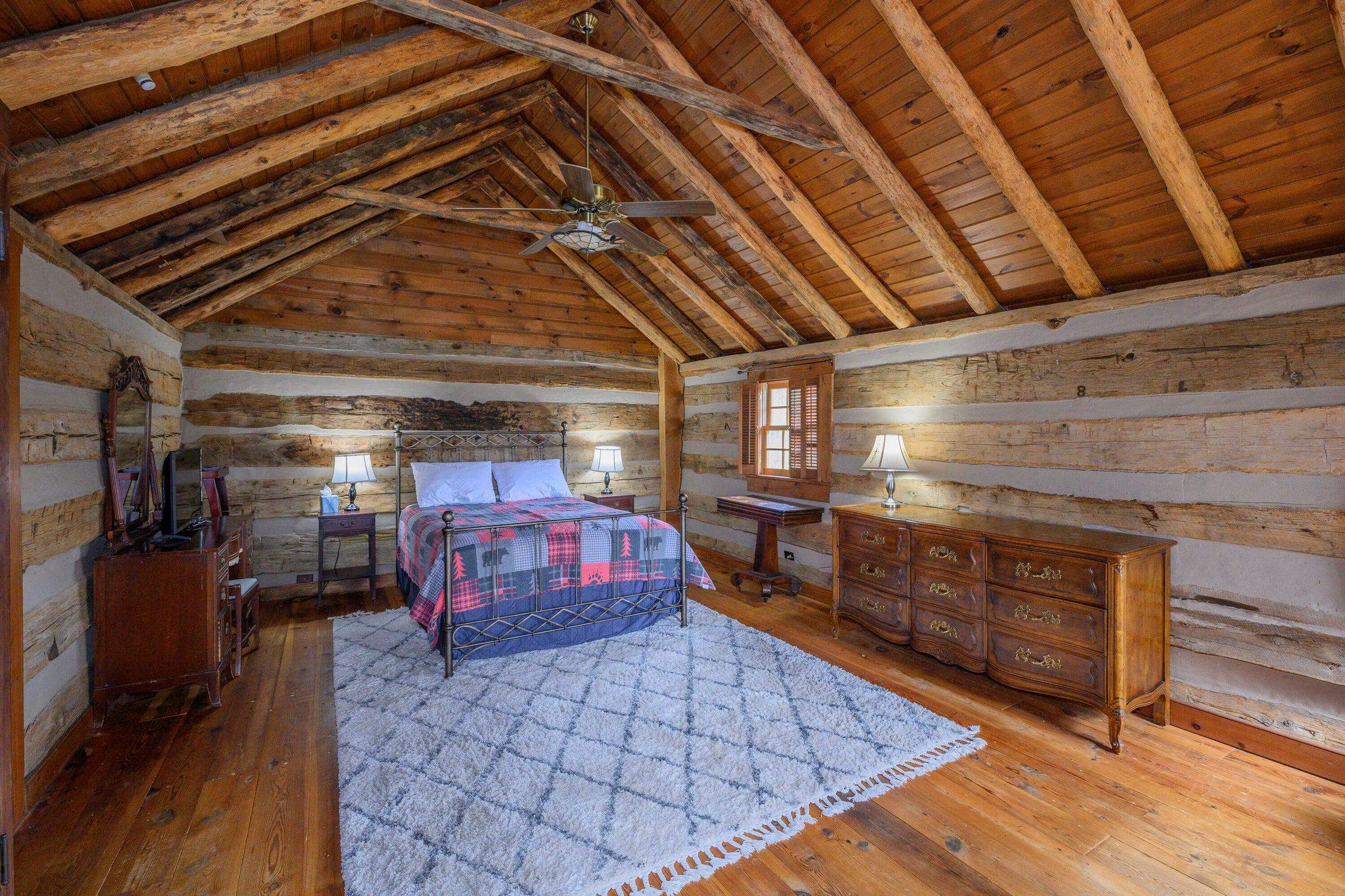 Elegant vaulted ceilings makes this primary bedroom even more spacious!