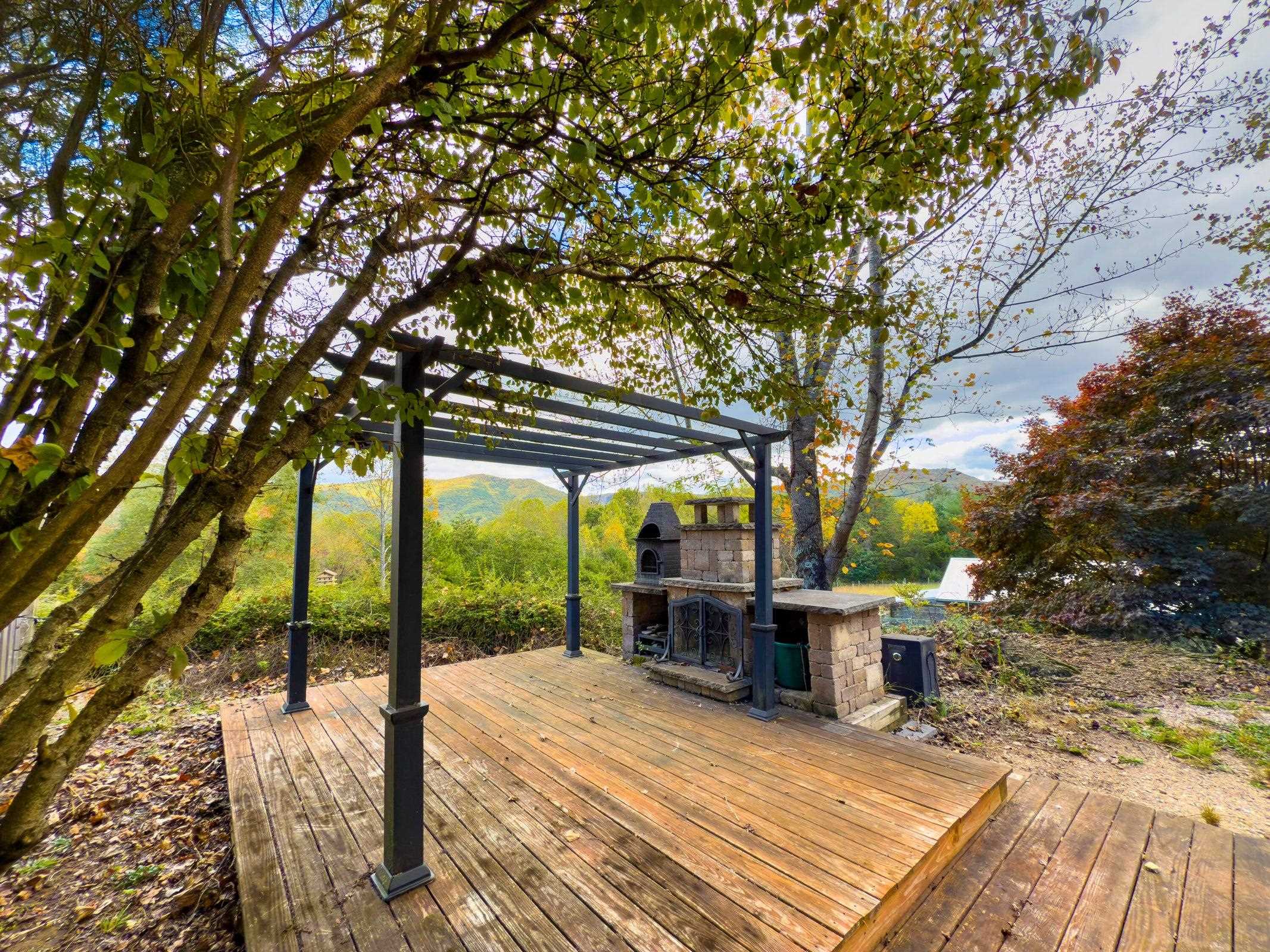 Outdoor patio complete with pergola and stone outdoor kitchen.