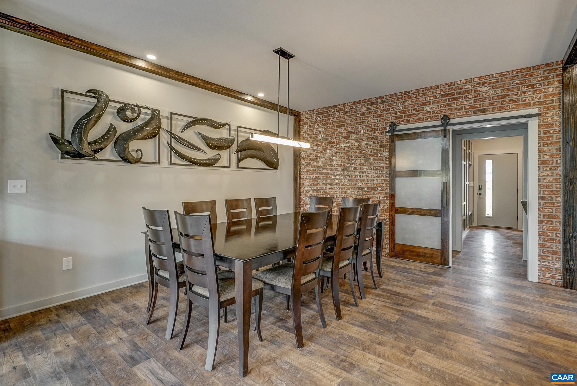 Large dining room with modern lighting.