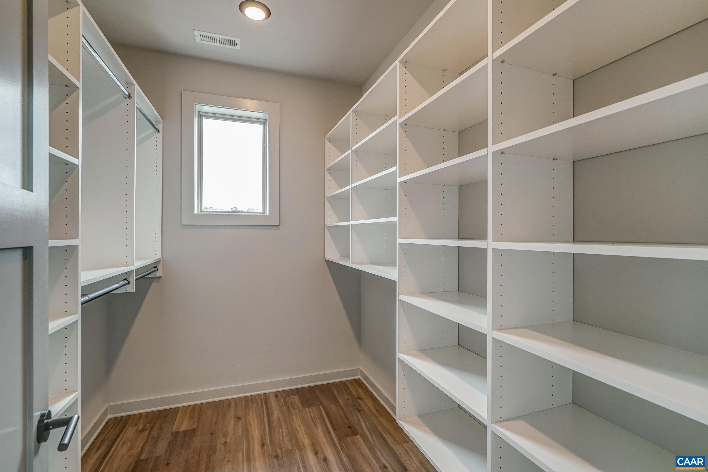 Two custom closets in primary suite.