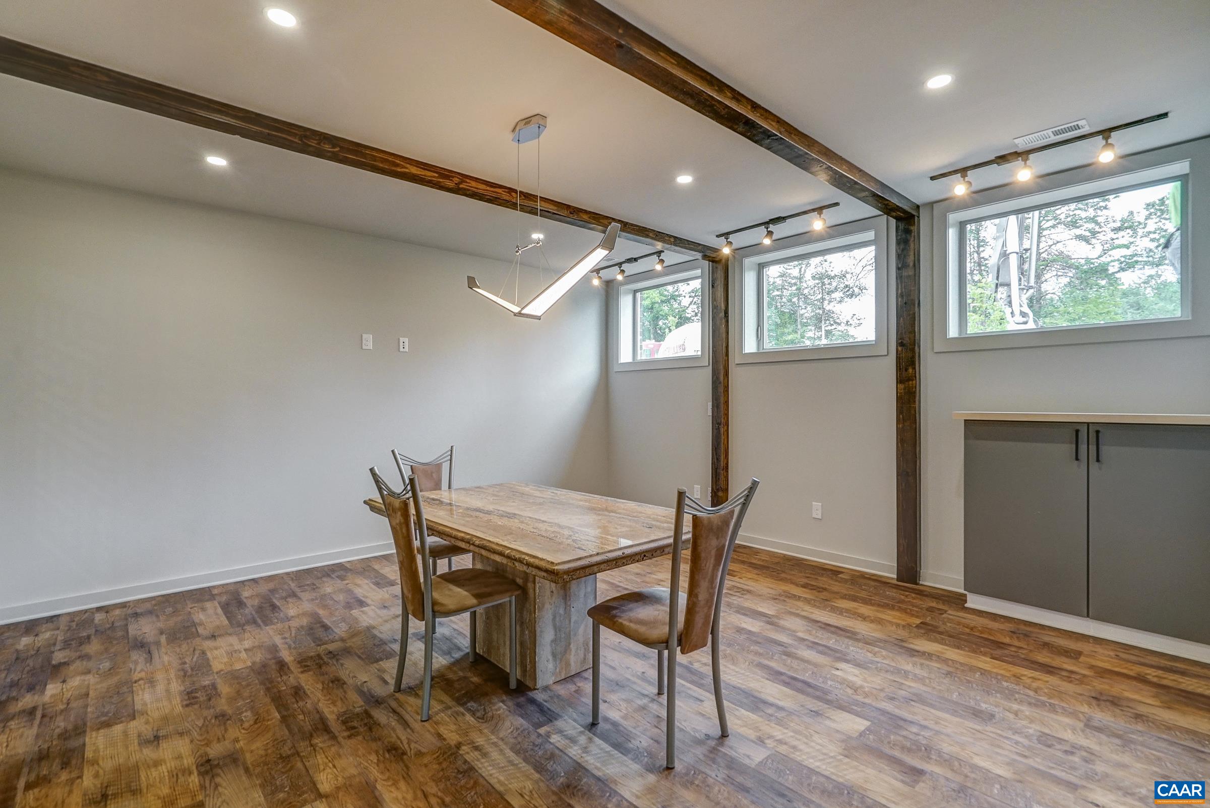 Basement features multifunctional space that could be an office or gaming room.