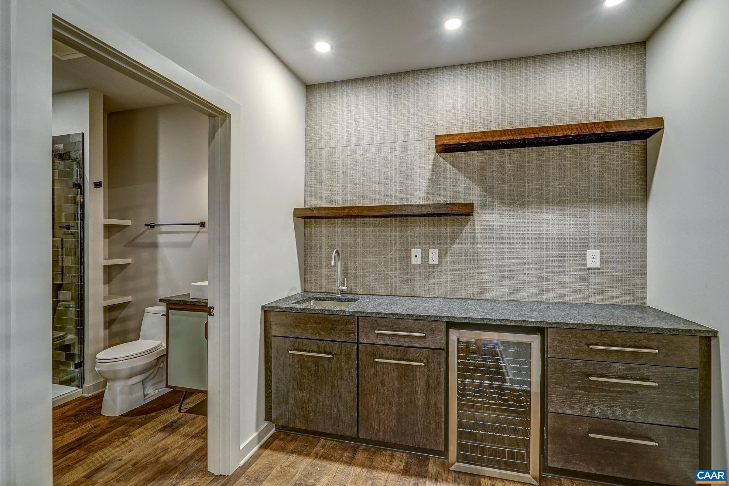 Wet bar on lower level is perfect for movie night!