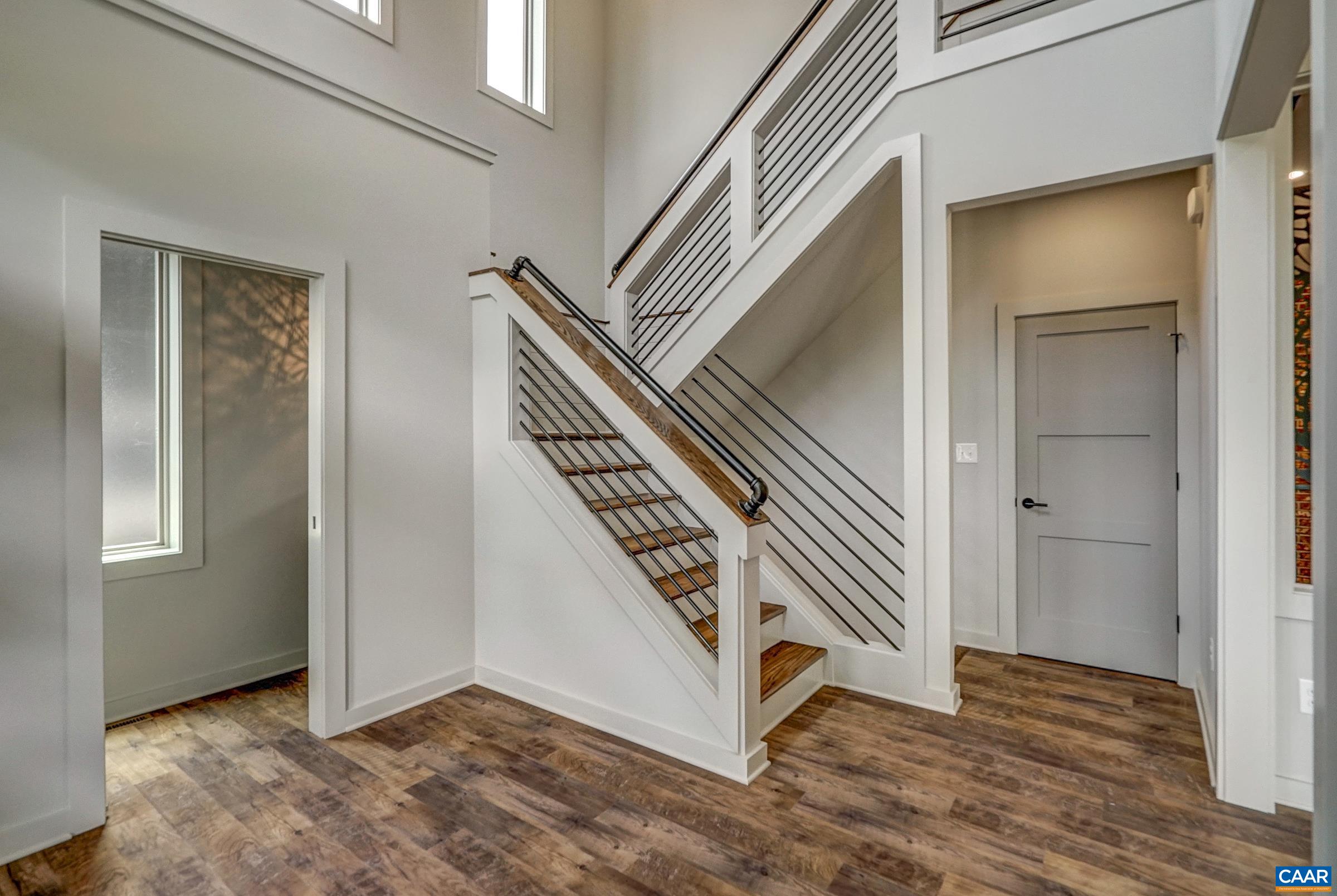 Grand two-story foyer welcomes you to this contemporary home.