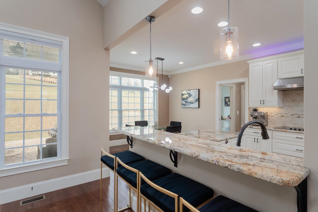 Seating options galore with a breakfast bar that seats 4, open to the great room, kitchen and eat-in kitchen.