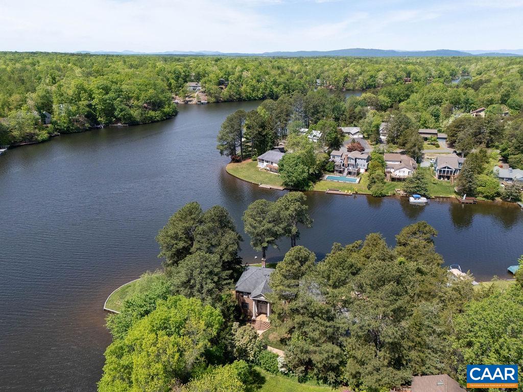 Enjoy direct, private water access for swimming and boating on one of Lake Monticello's most spectacular lots.