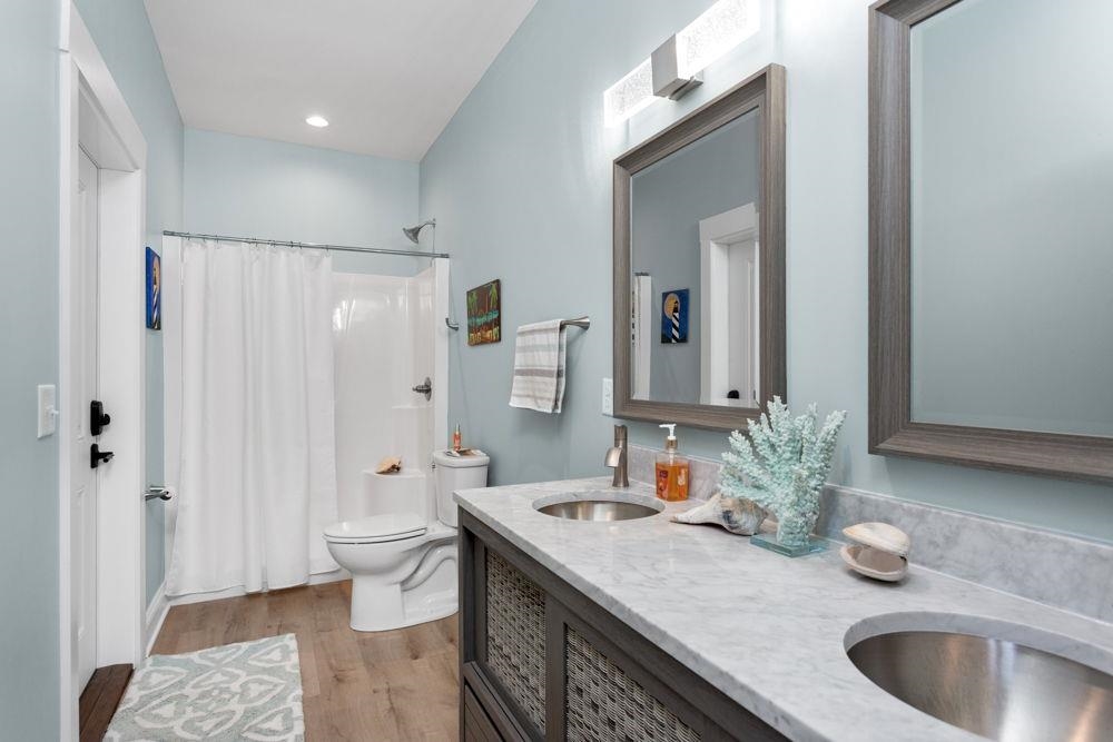 off of office with access to rear patio and pool area.