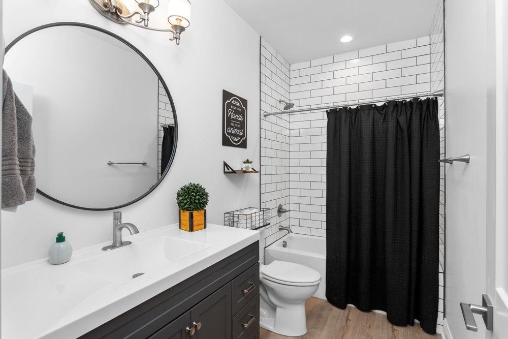located between the 2nd & 3rd bedroom.