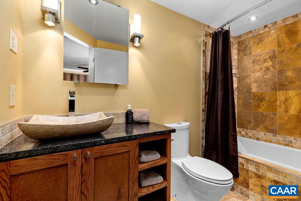 The primary bathroom has been redesigned and enlarged from the original bathroom layout.