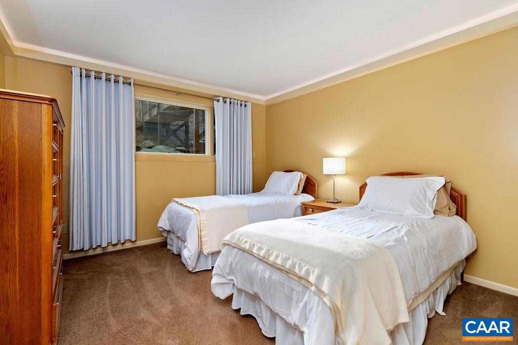 Guest bedroom on the main level. Both bedroom on the main level have luxury carpet.