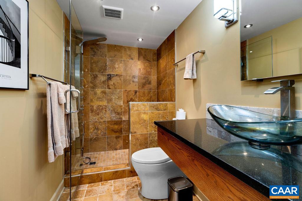 All bathrooms have been remodeled with luxury travertine tile floors and showers.