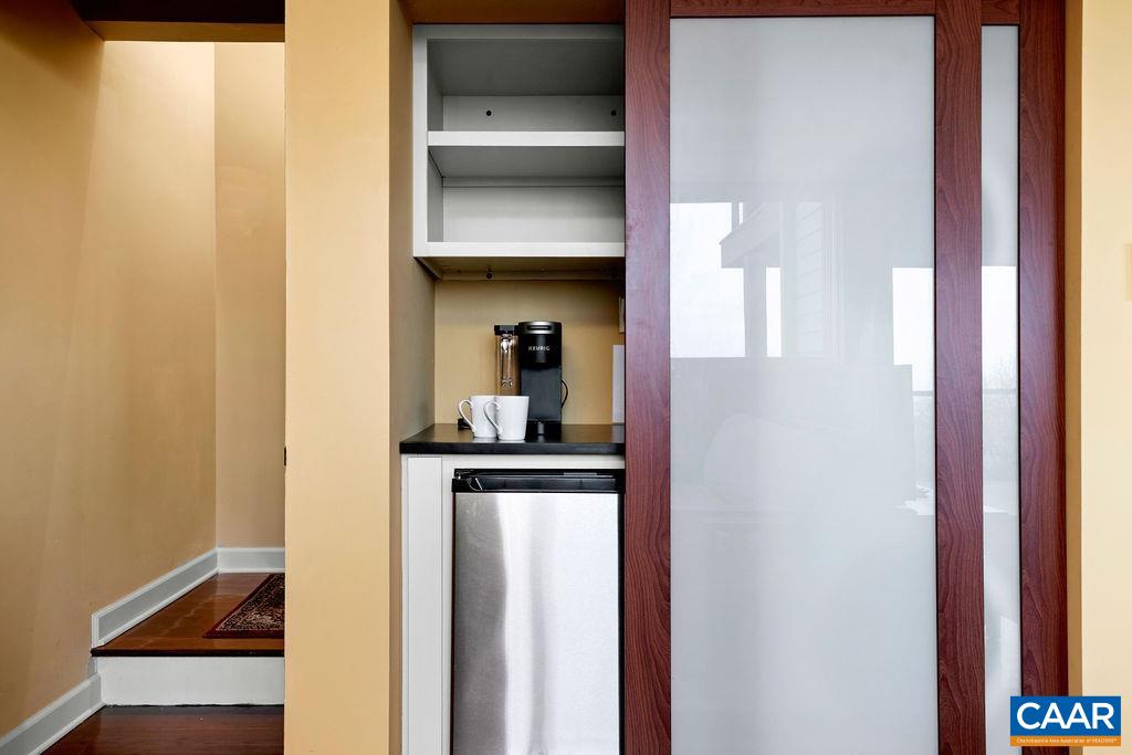 Coffee bar with a refrigerator in the lower level master suite.