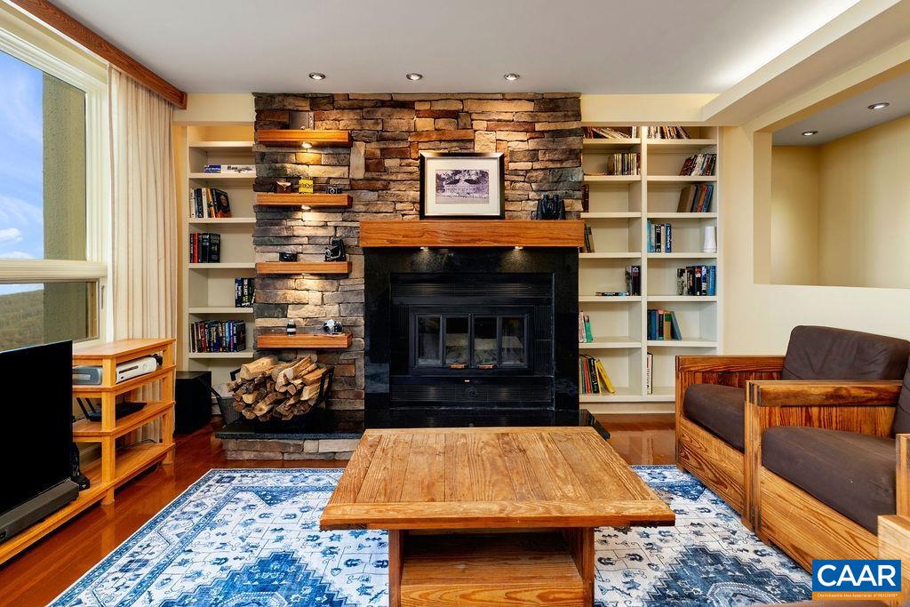 One of the two stone, wood burning fireplaces in the condo.