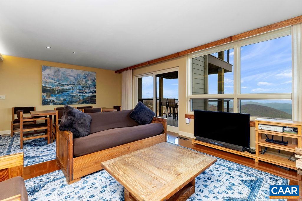 Solid oak wide plank wood floors in all rooms but for the two bedrooms on the main level and the bathrooms.