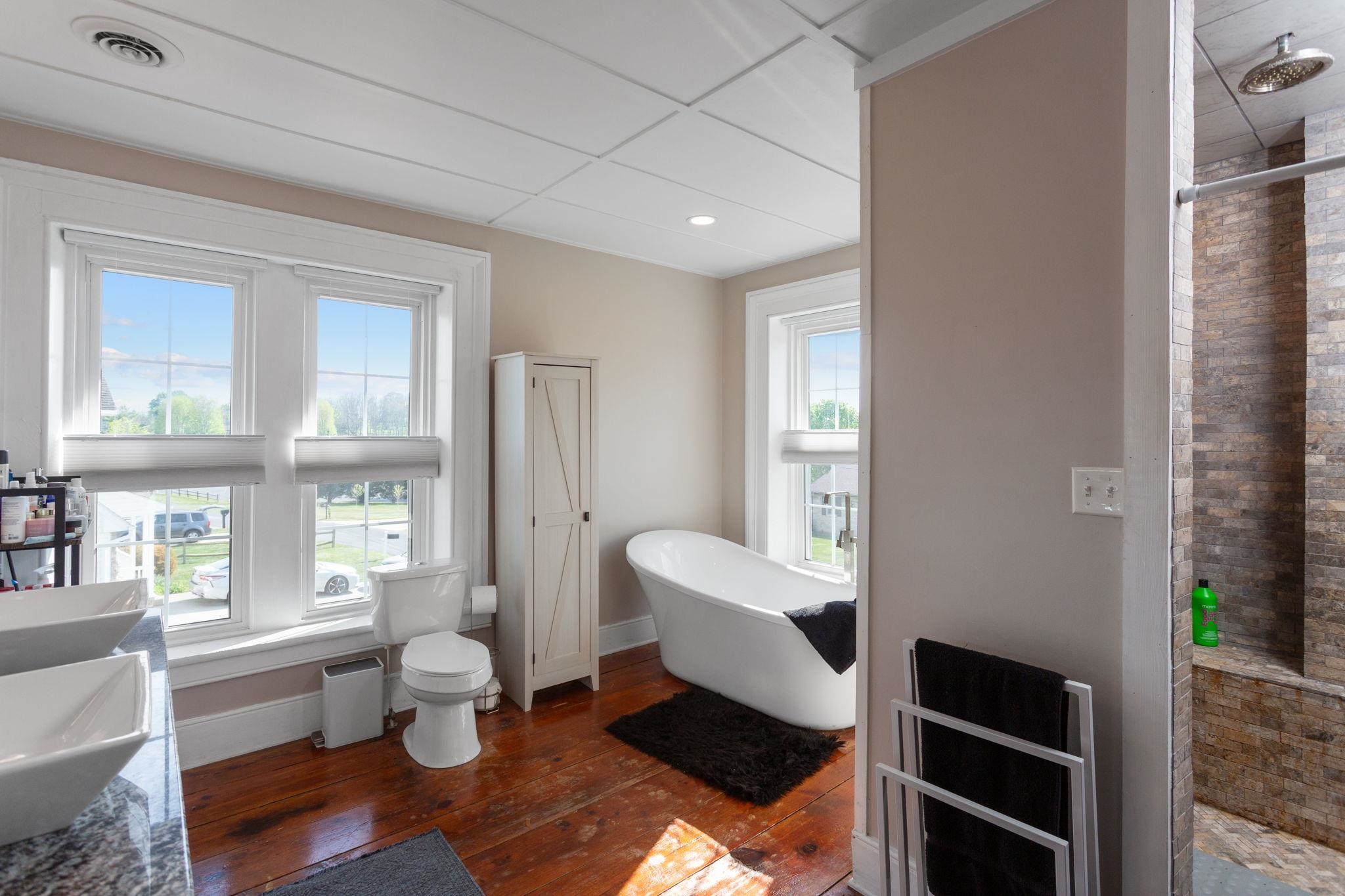 with full tile shower and soaking tub.