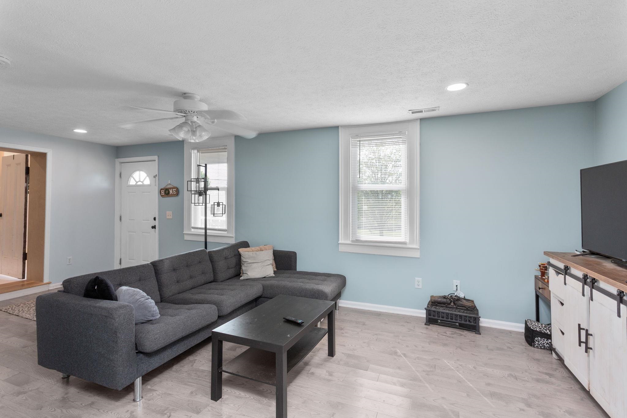 with entrance from wrap around porch and access to main living area for children to live in this half.