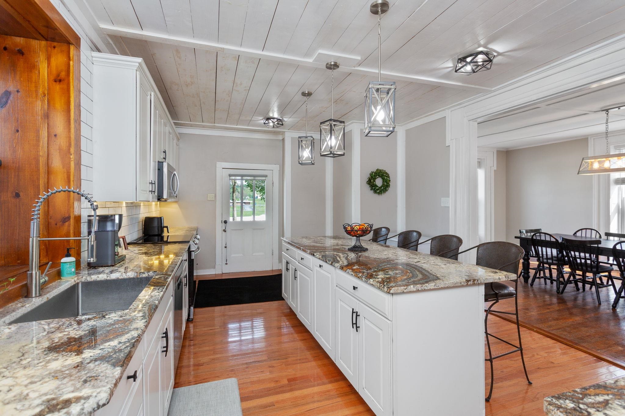 Looking from mudroom and laundry into kitchen.