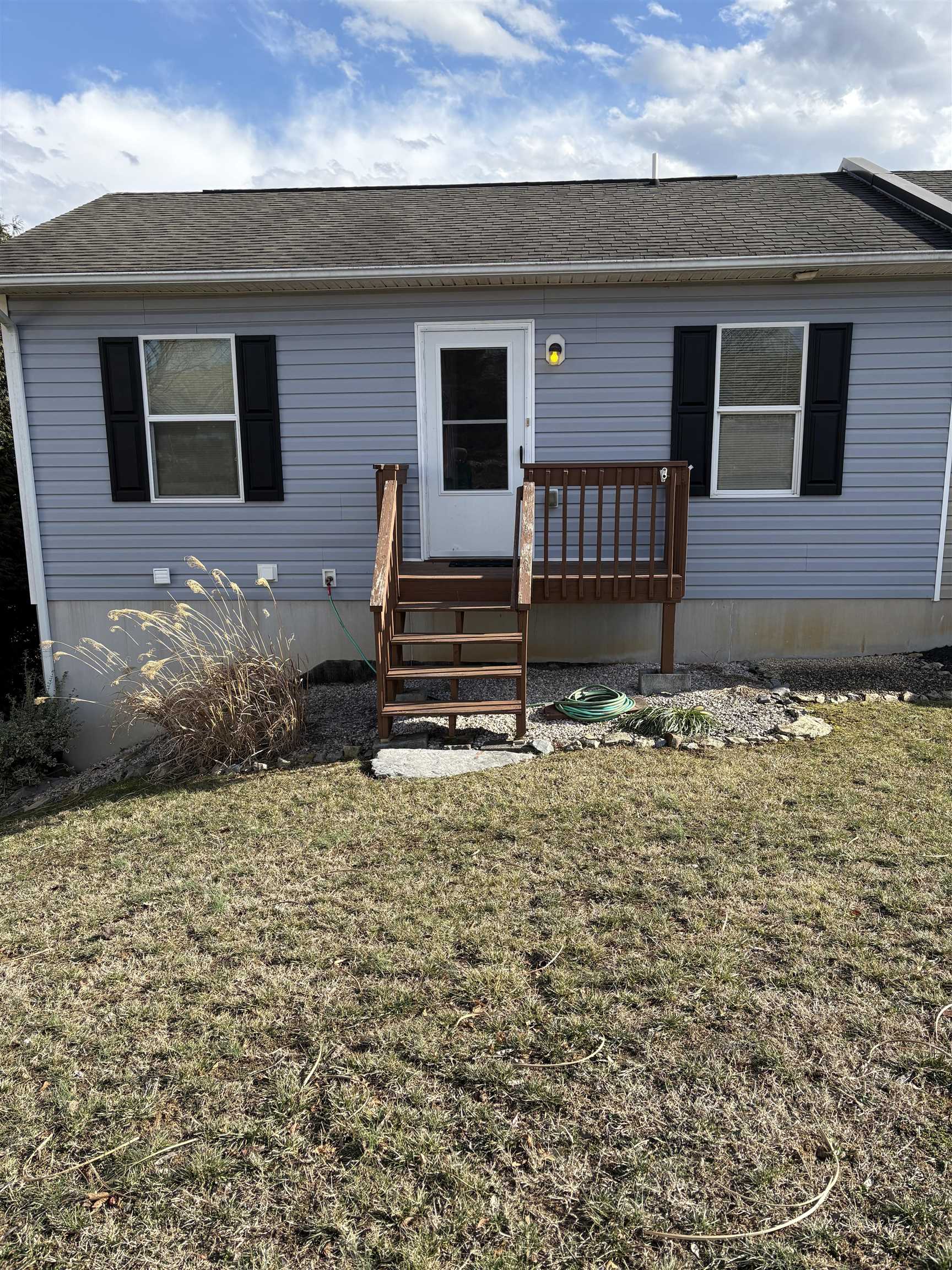 Small deck overlooking back yard.  Accessible from upstairs.