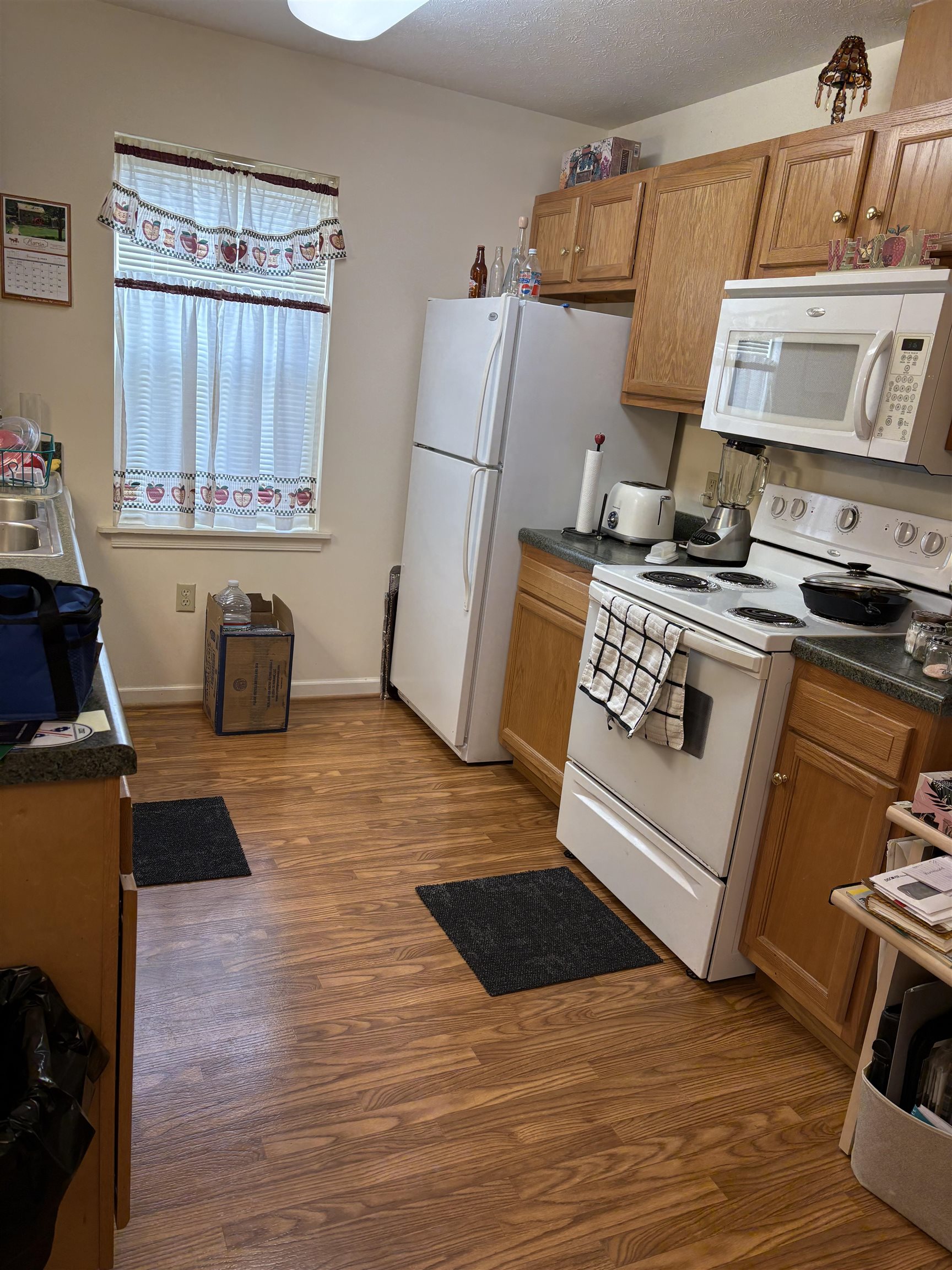Range, refrigerator, and dishwasher convey.  Dining area is adjacent to kitchen, currently used as computer work area.