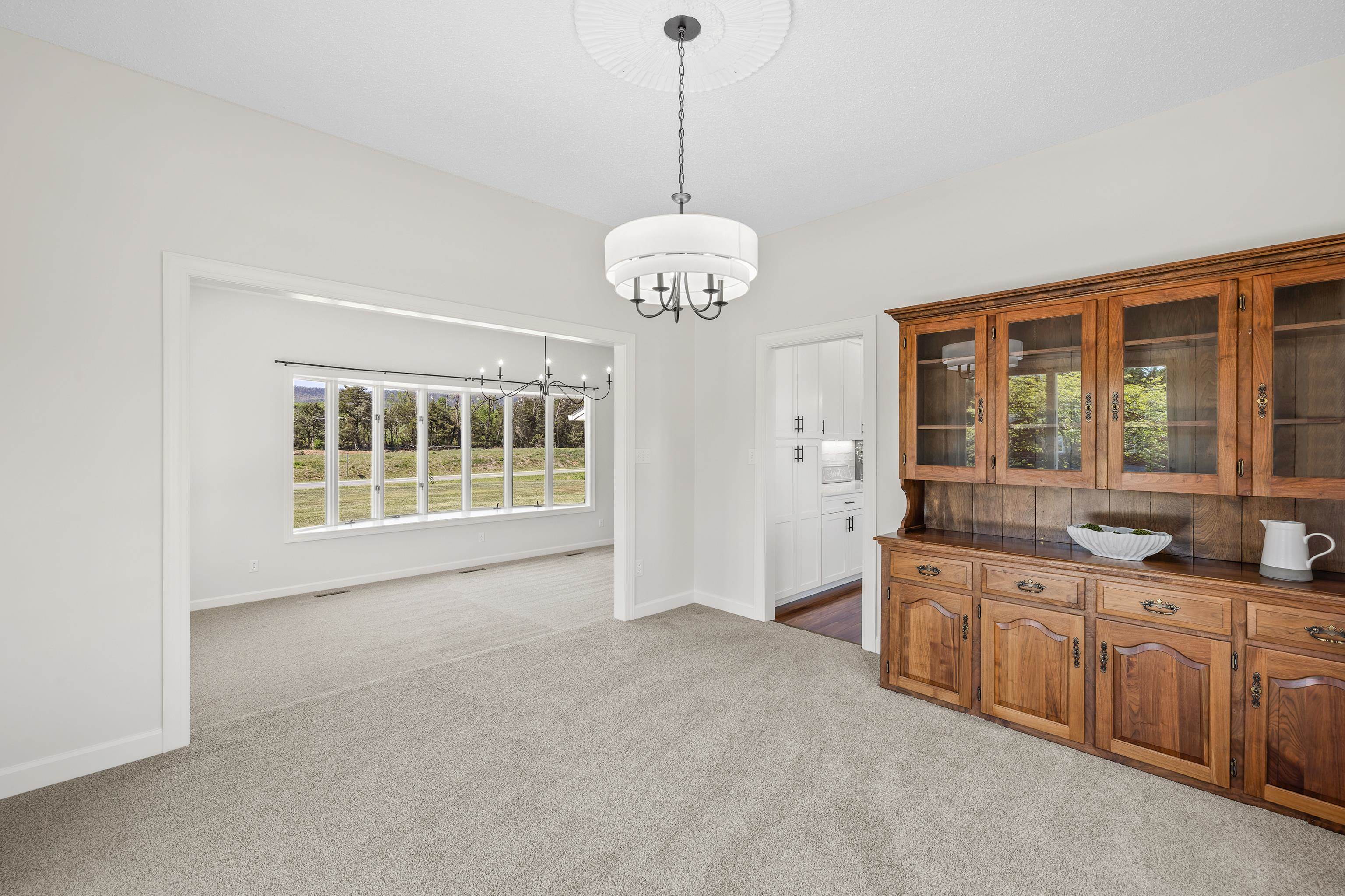 The dining room allows you to extend family and friend gatherings onto a spacious side porch.
