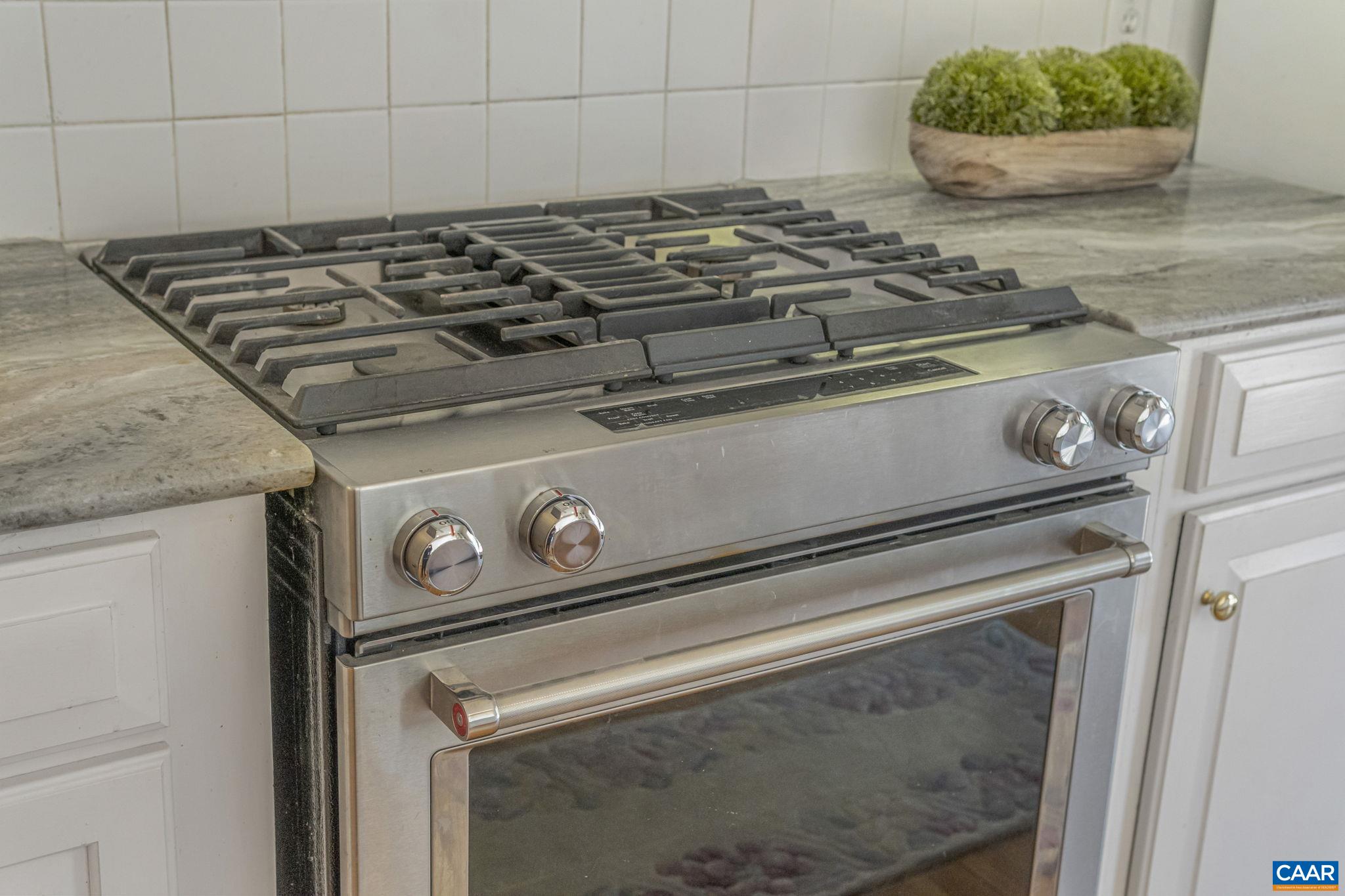 Dual Fuel Kitchen Aid Range, with option to change out two burners for griddle.