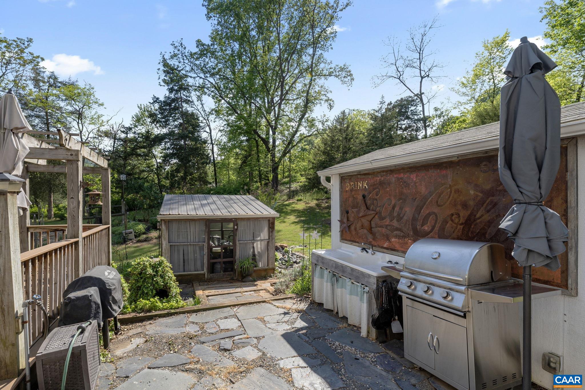 Vintage cast iron sink, and lots of space for grills and smokers!