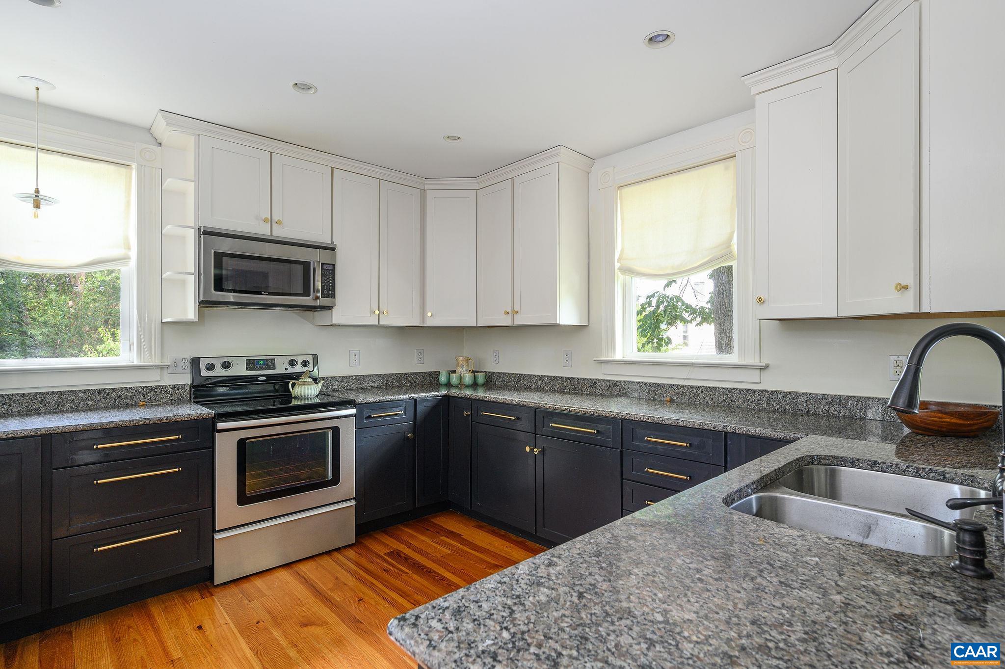 Kitchen has granite counters and stainless appliances.
