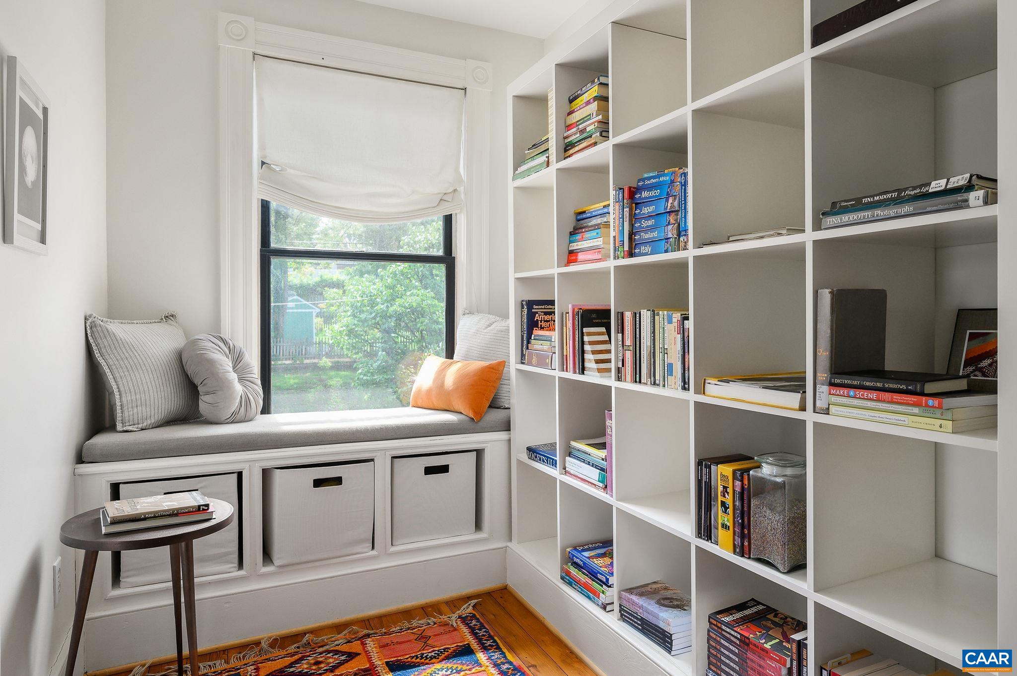 Built-in cabinetry and window seat in the upper hallway.