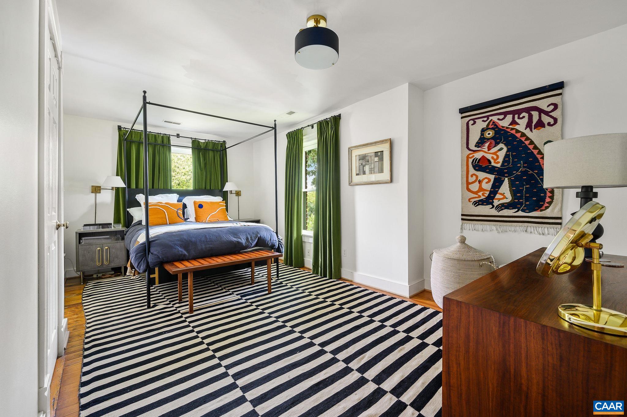 Large primary bedroom with walk-in closet and attached bath.