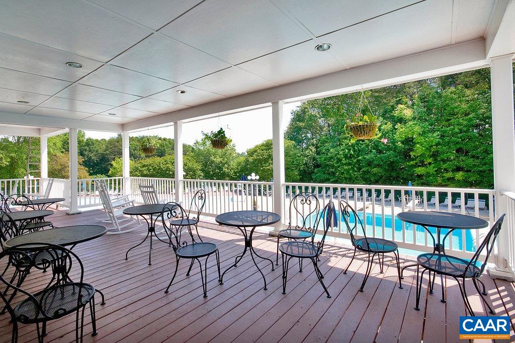 Covered balcony overlooking pool at North facility