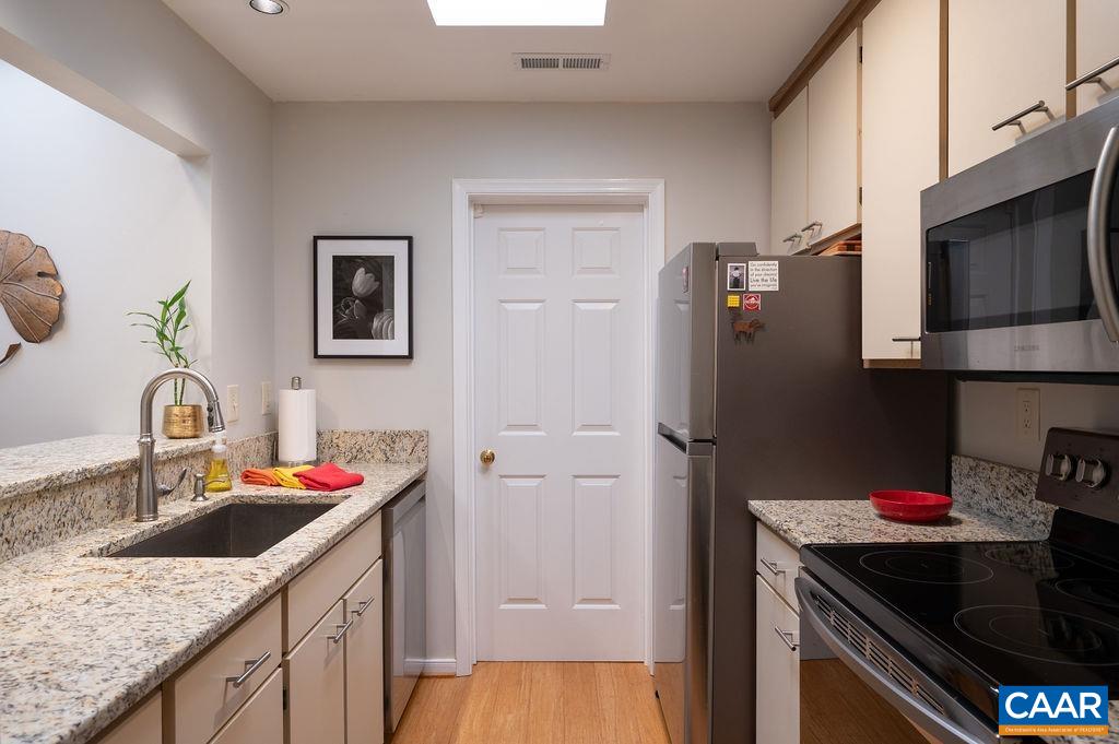 Updated with granite counters and new appliances. Has a skylight.
