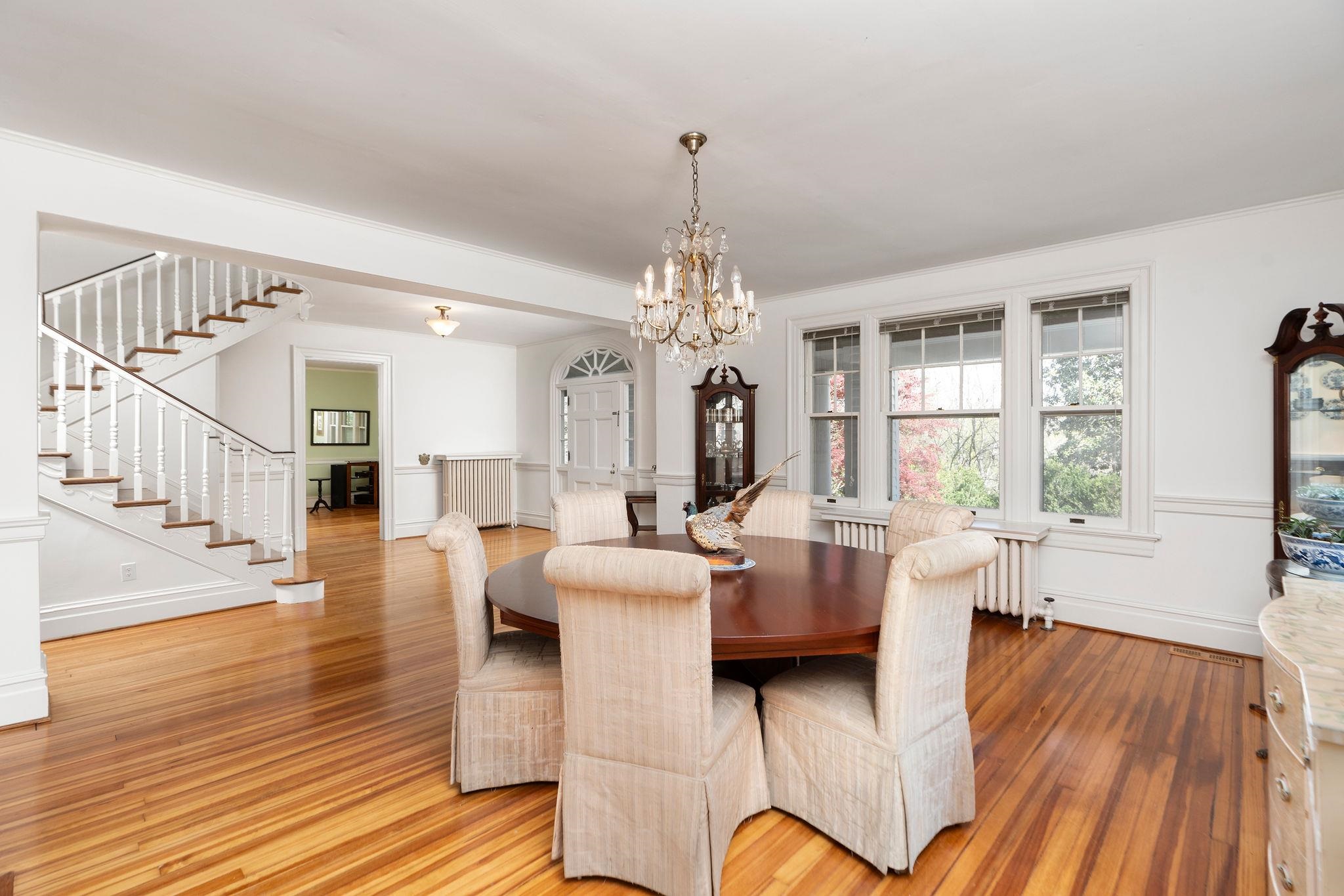 Entertain guests at this wonderful open dining area while overlooking the private grounds through the gorgeous leaded windows.