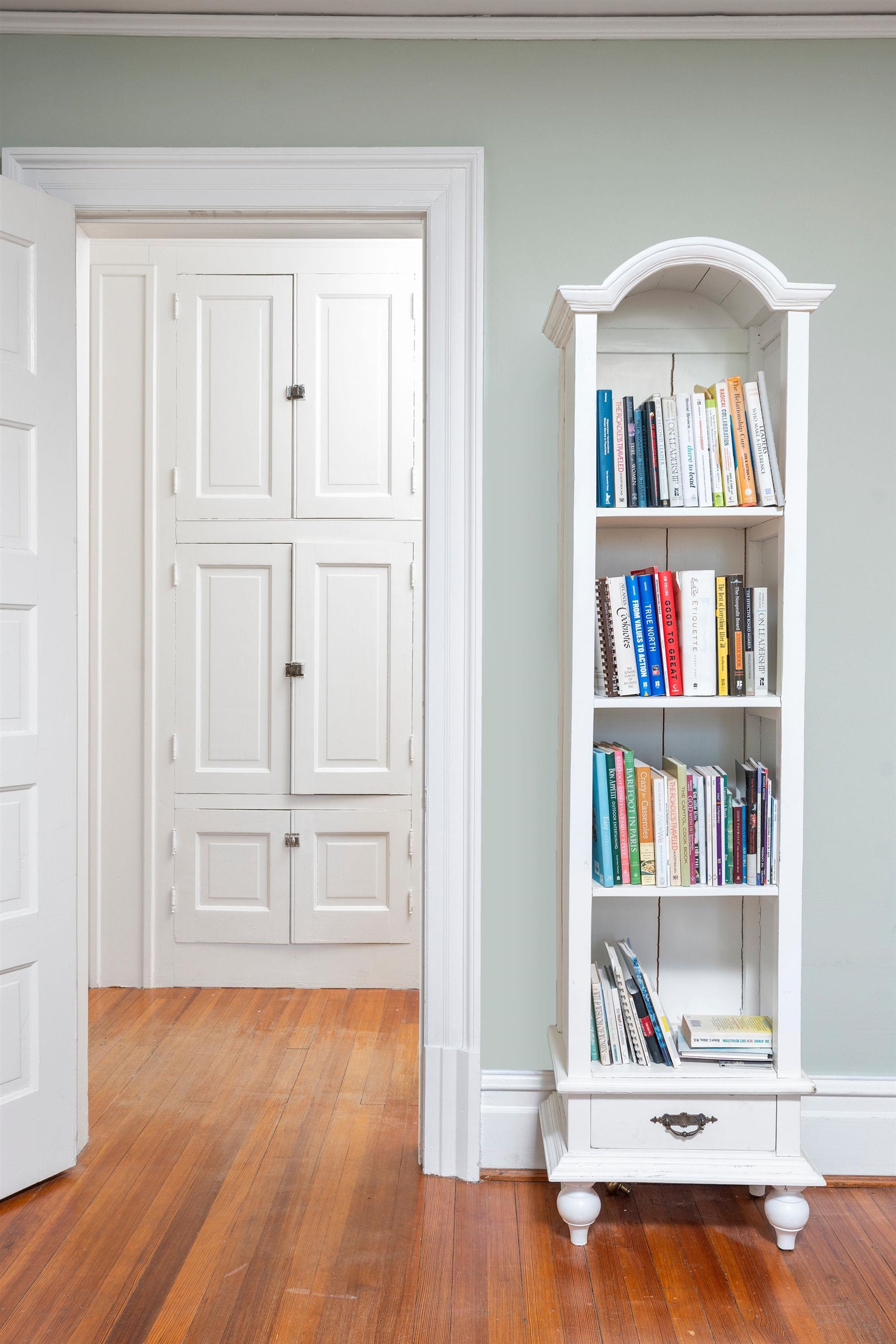 This linen closet is located in the hall leading to the primary bedroom and bath.