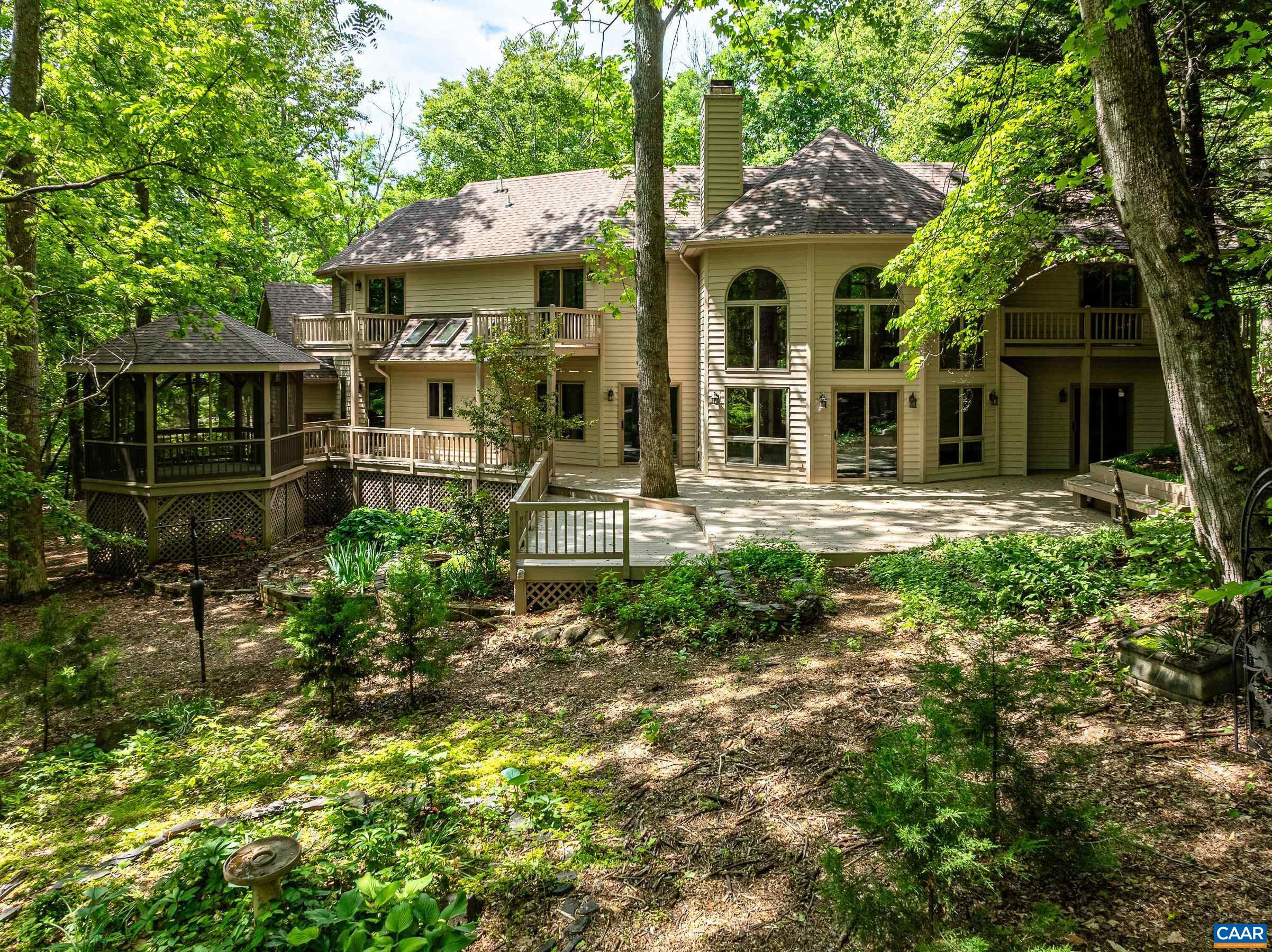 Shaded rear yard with expansive patio. Every bedroom features a private balcony.