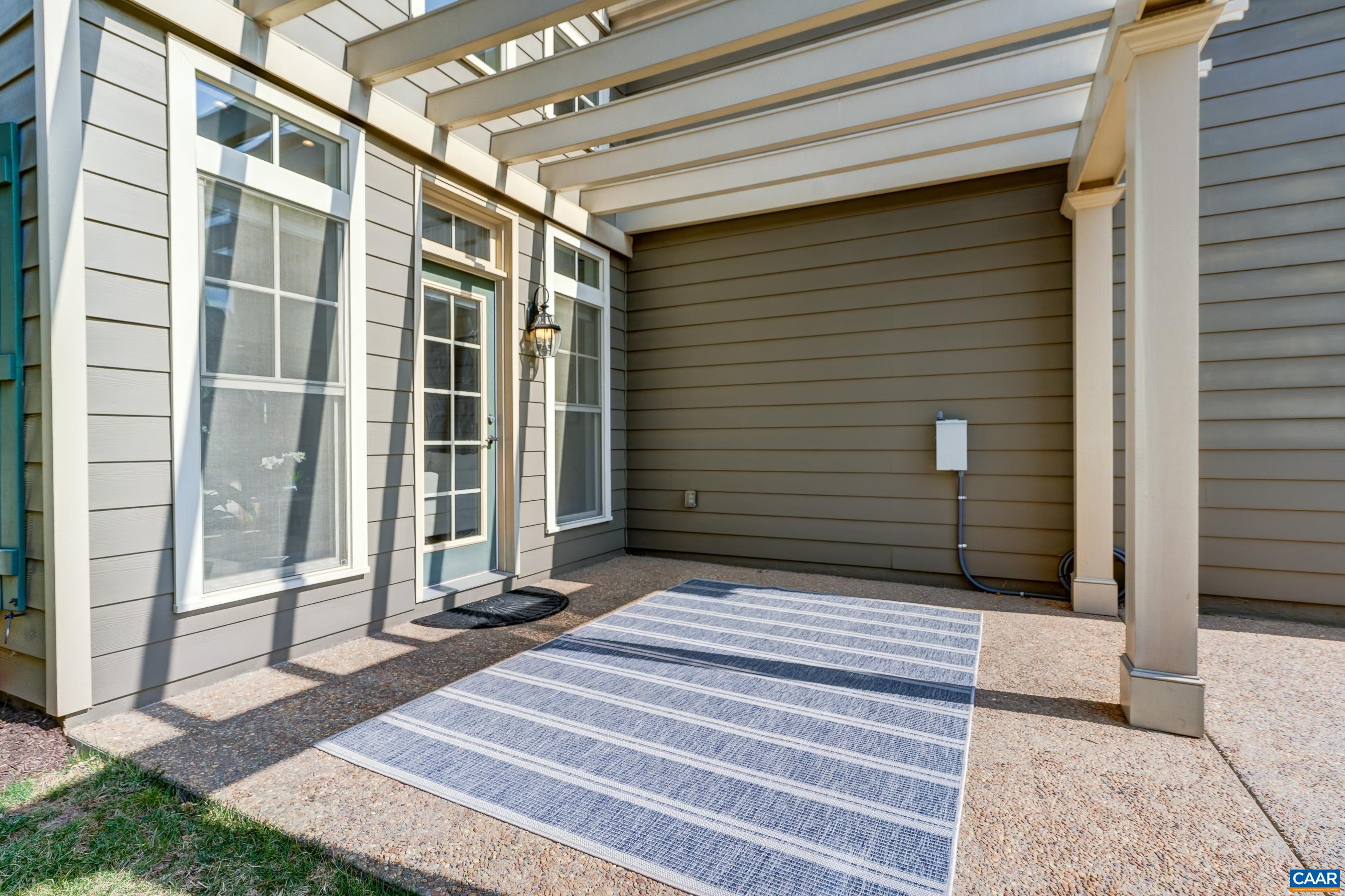 Dine and relax outdoors on the expansive patio with pergola.