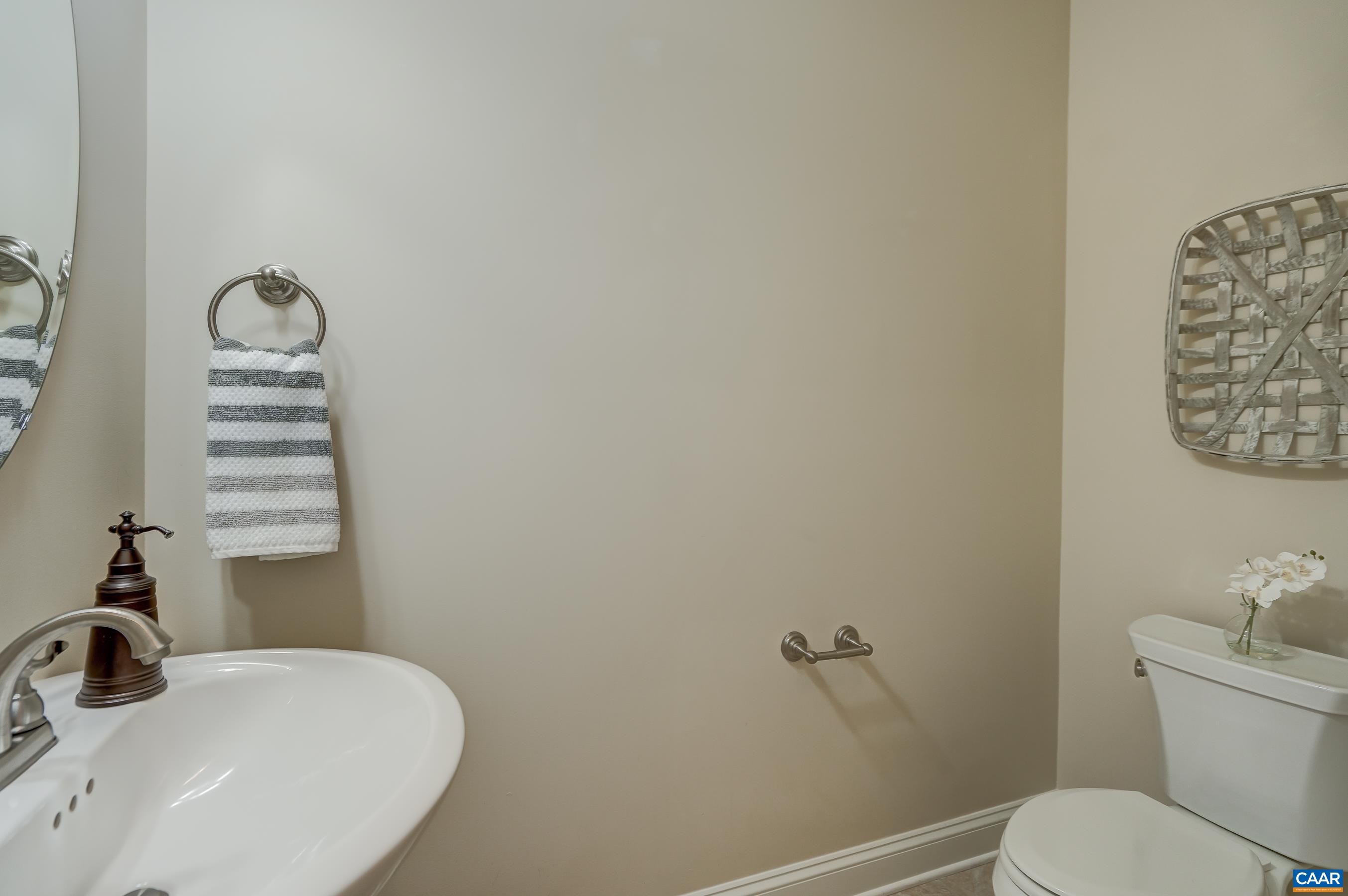 Powder room with pedestal sink.