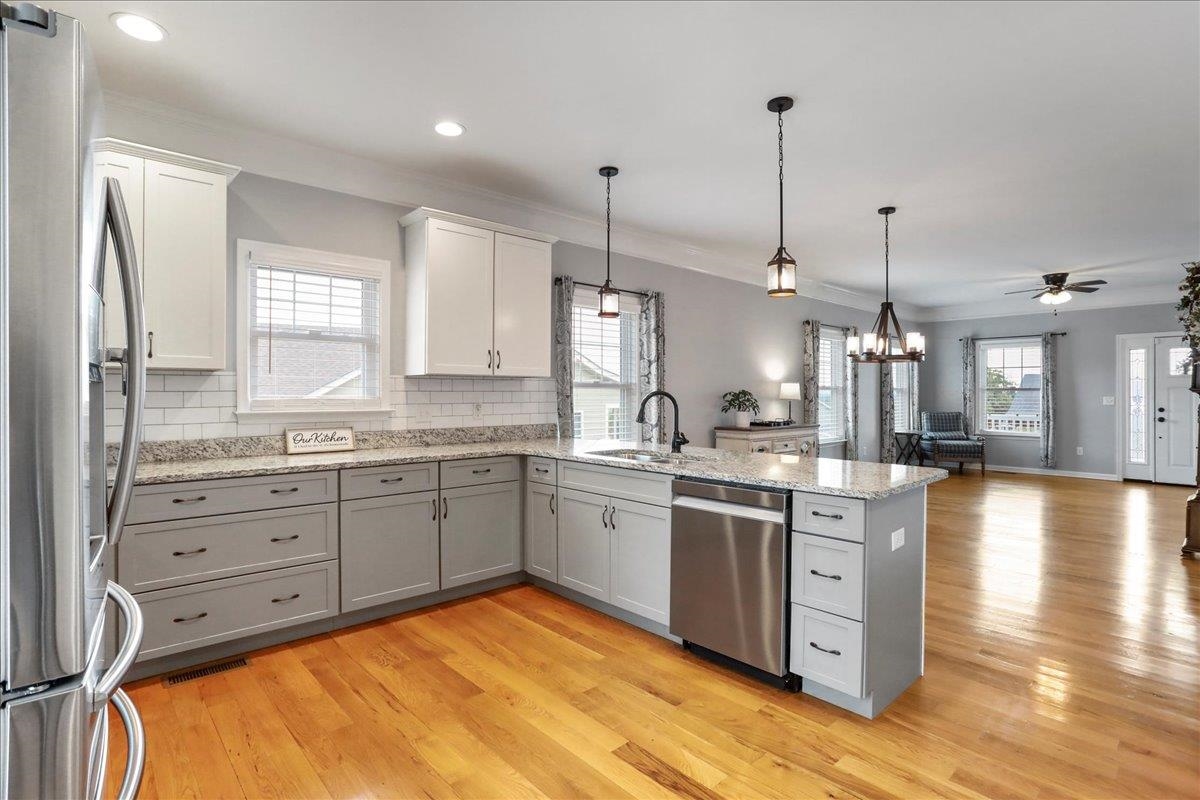 Full of natural light, stainless steel Samsung appliances.