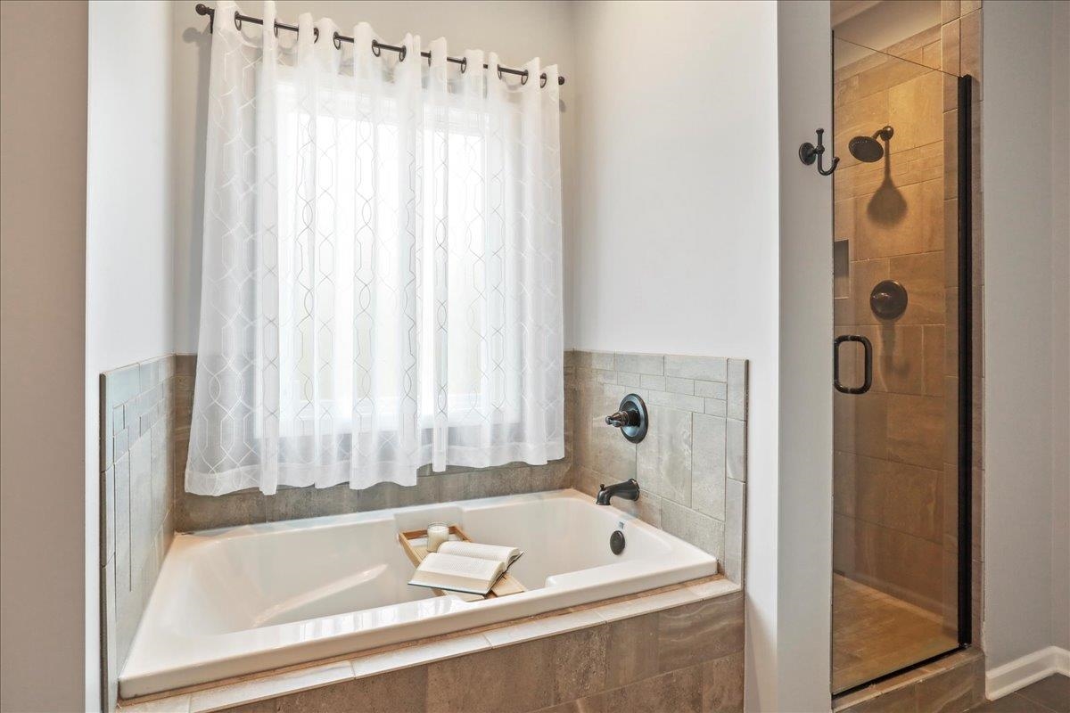 Relax in a soaking tub or use the large walk-in shower to unwind