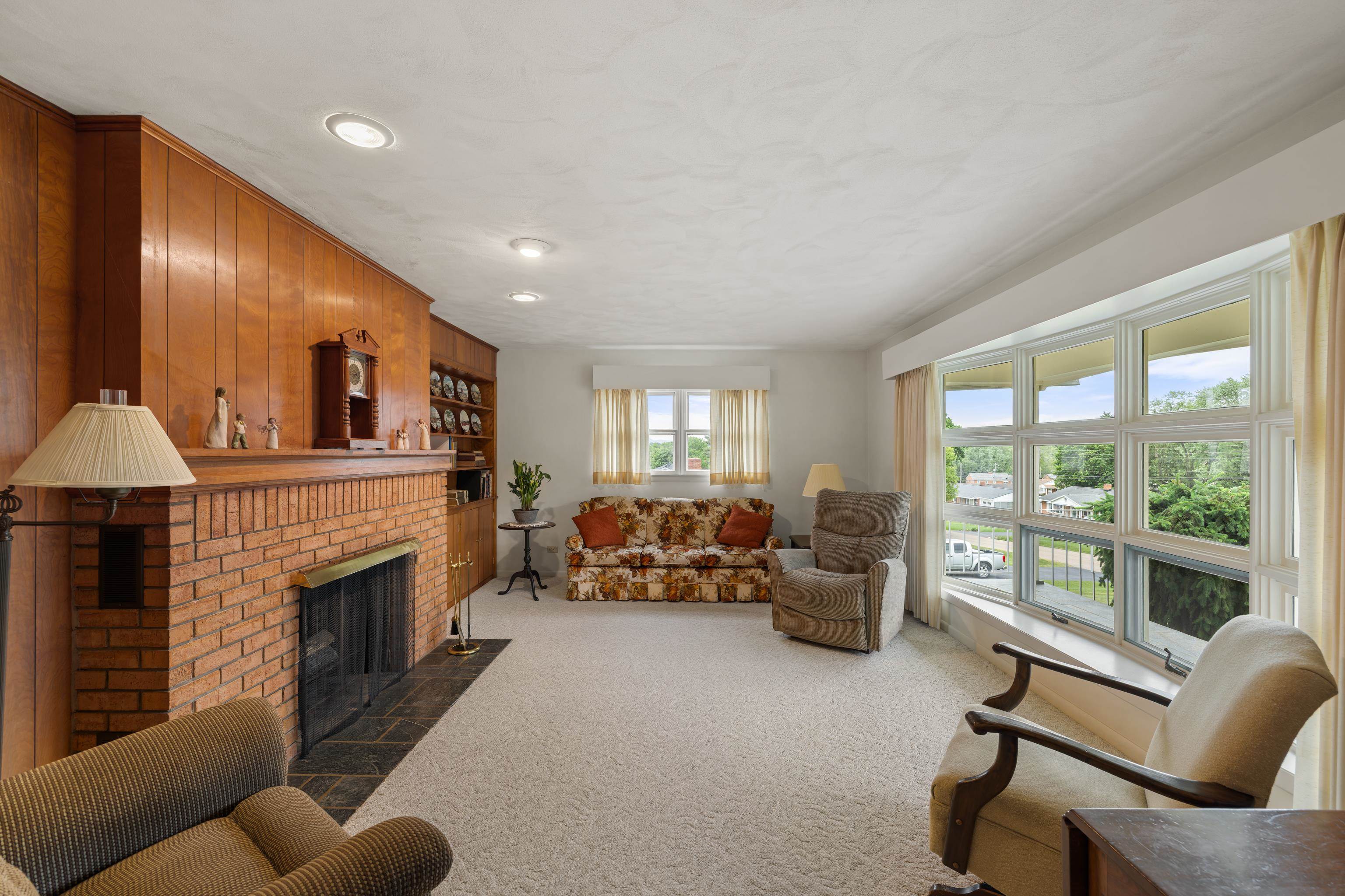 *Large bay window, wood-burning fireplace, built-ins, and professionally cleaned carpet.