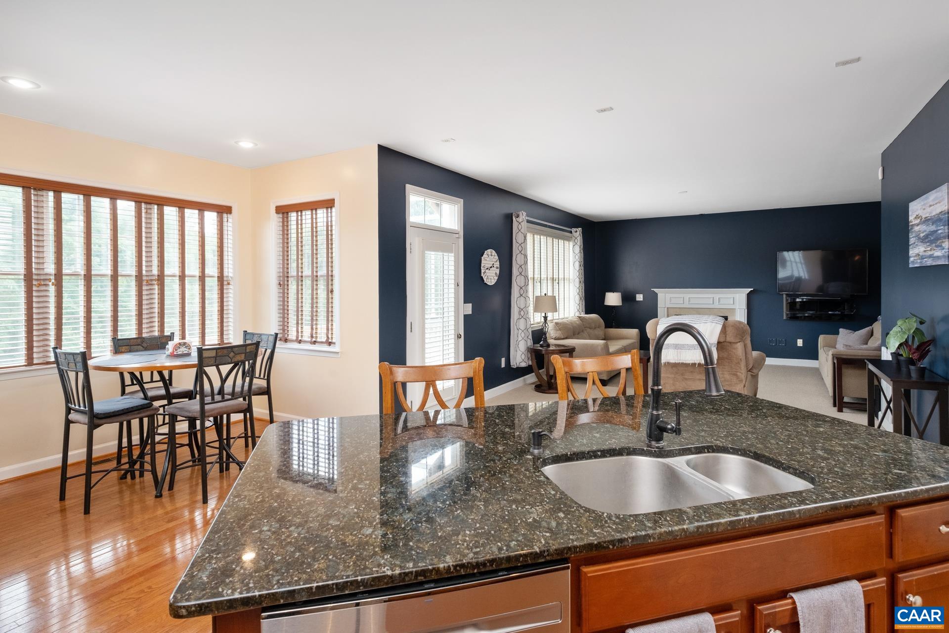 Kitchen to living room and back deck.  Eat-in area is in view.