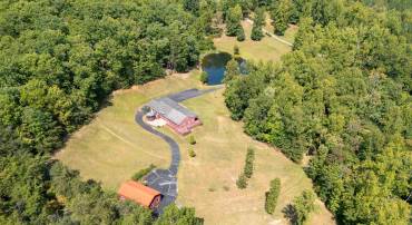 52+ acres with a stocked pond!