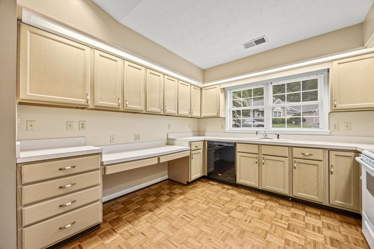 Lots of counter and cabinet space and lots of natural light. Easy to maintain parquet floor