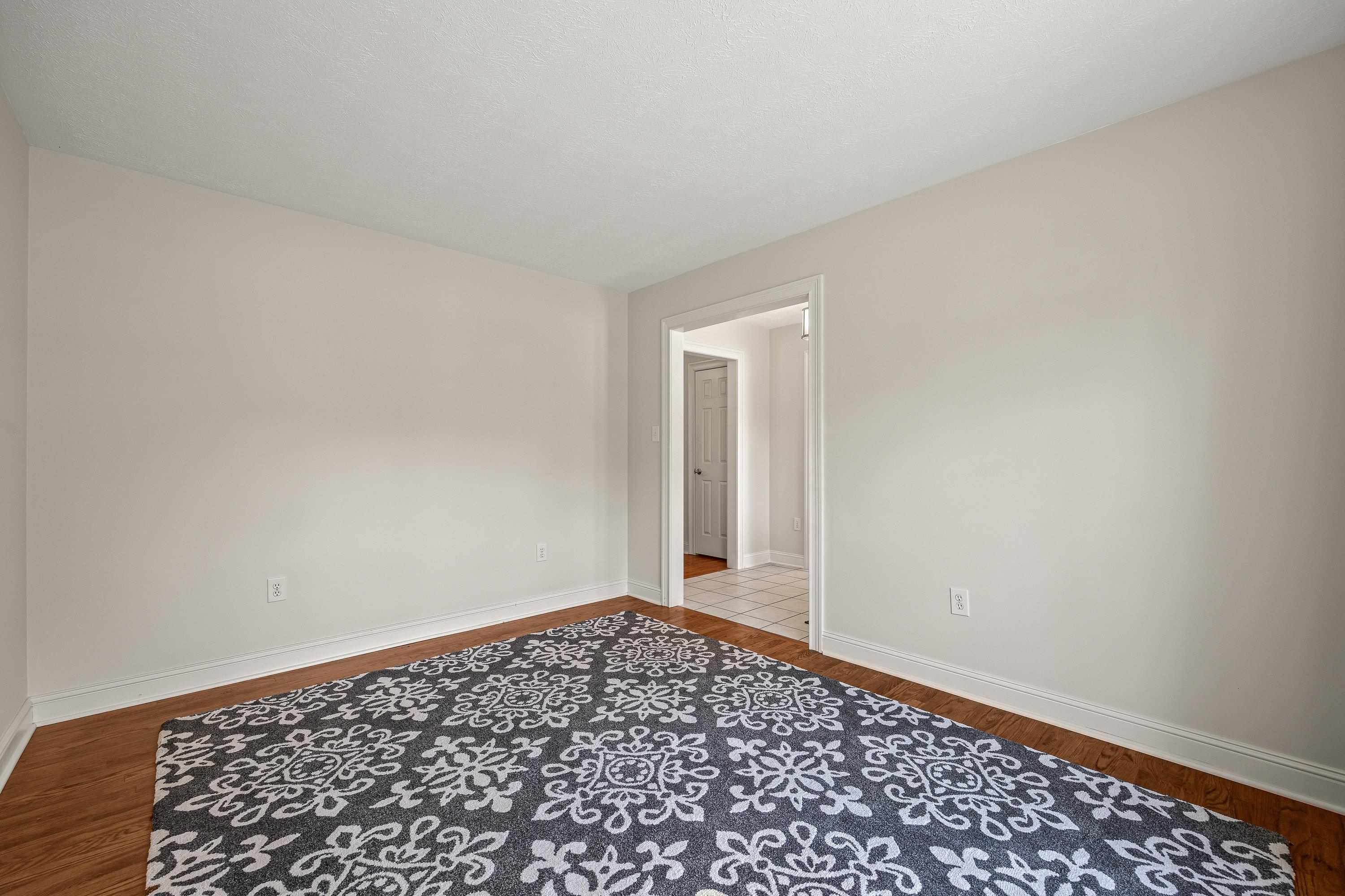 This large room can be used as formal living room, home office, and more!  This space offers hardwood flooring throughout.