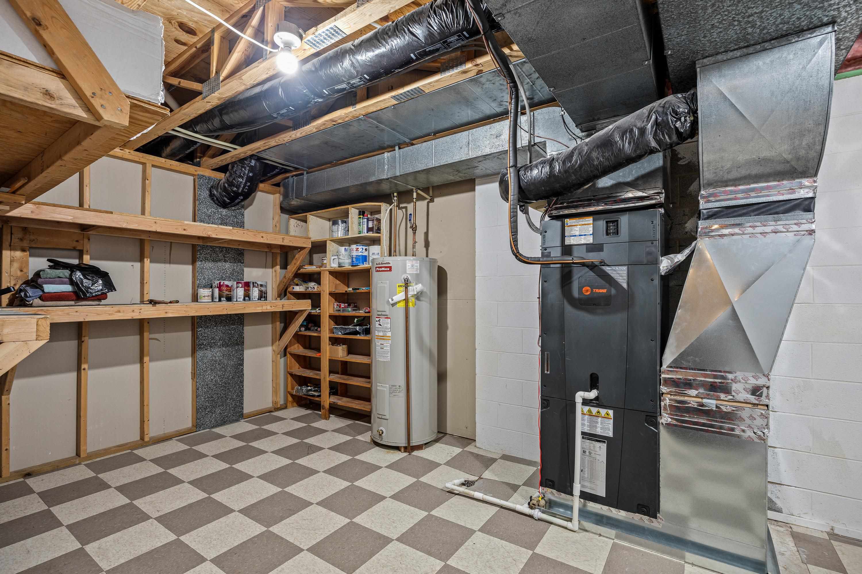 The utility room houses all the major systems in the home and contains an abundance of storage!