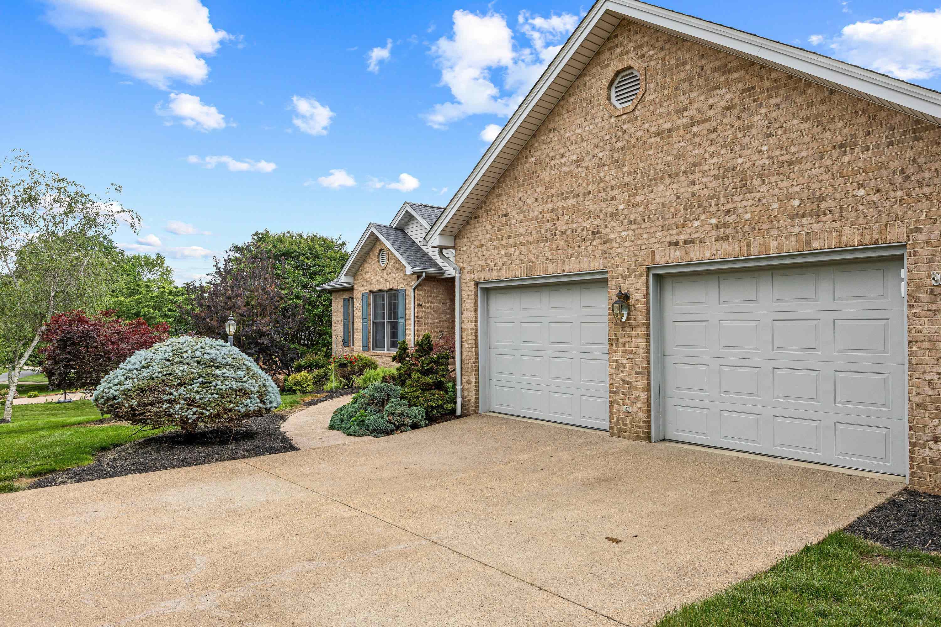 The front view of the beautiful home located at 2875 Barrington Drive in the lovely and established neighborhood of Barrington Estates.  The front view highlights the brick exterior of the home, two car garage, and mature landscaping surrounding the home!