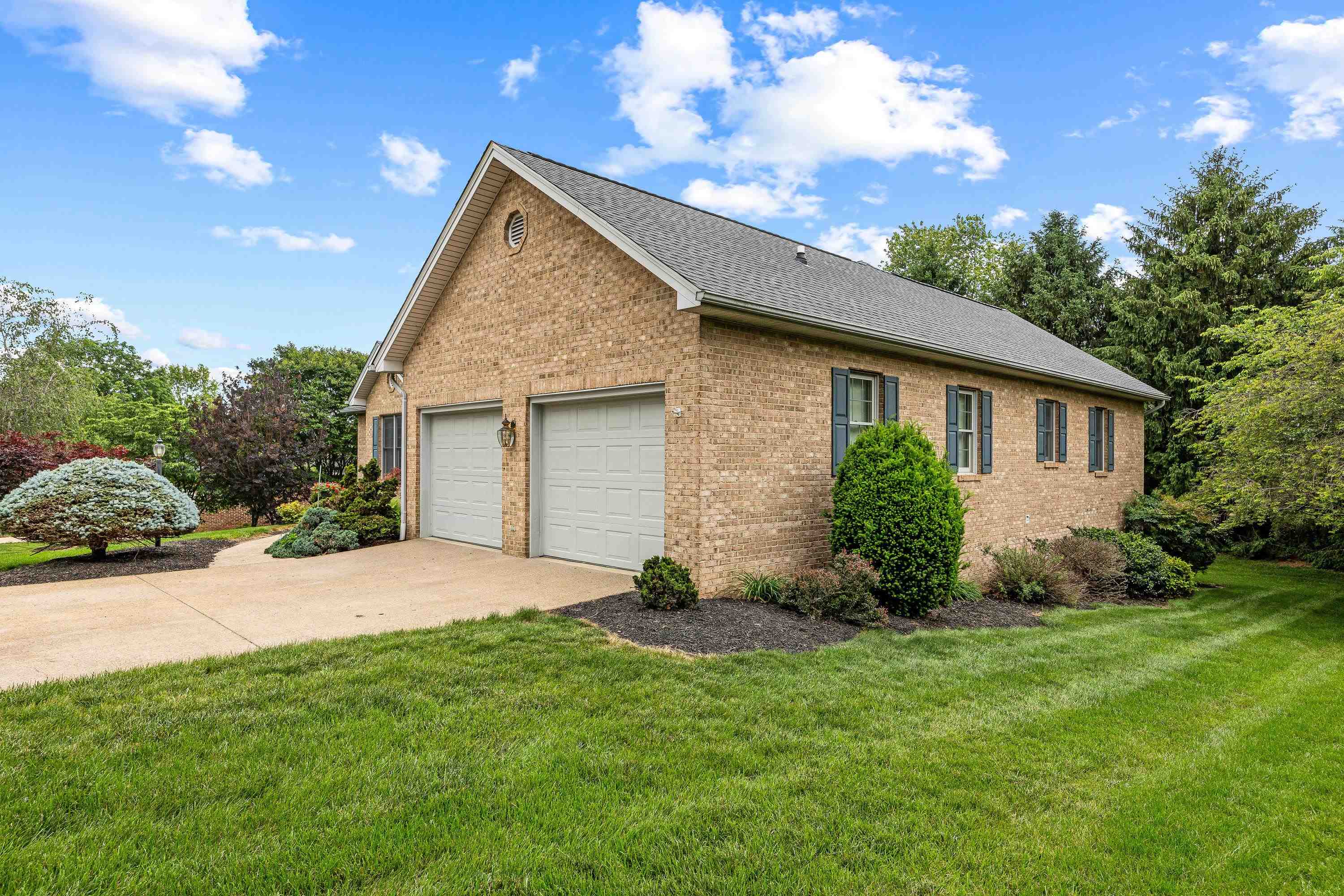 The front view of the beautiful home located at 2875 Barrington Drive in the lovely and established neighborhood of Barrington Estates.  The front view highlights the brick exterior of the home, two car garage, and mature landscaping surrounding the home!