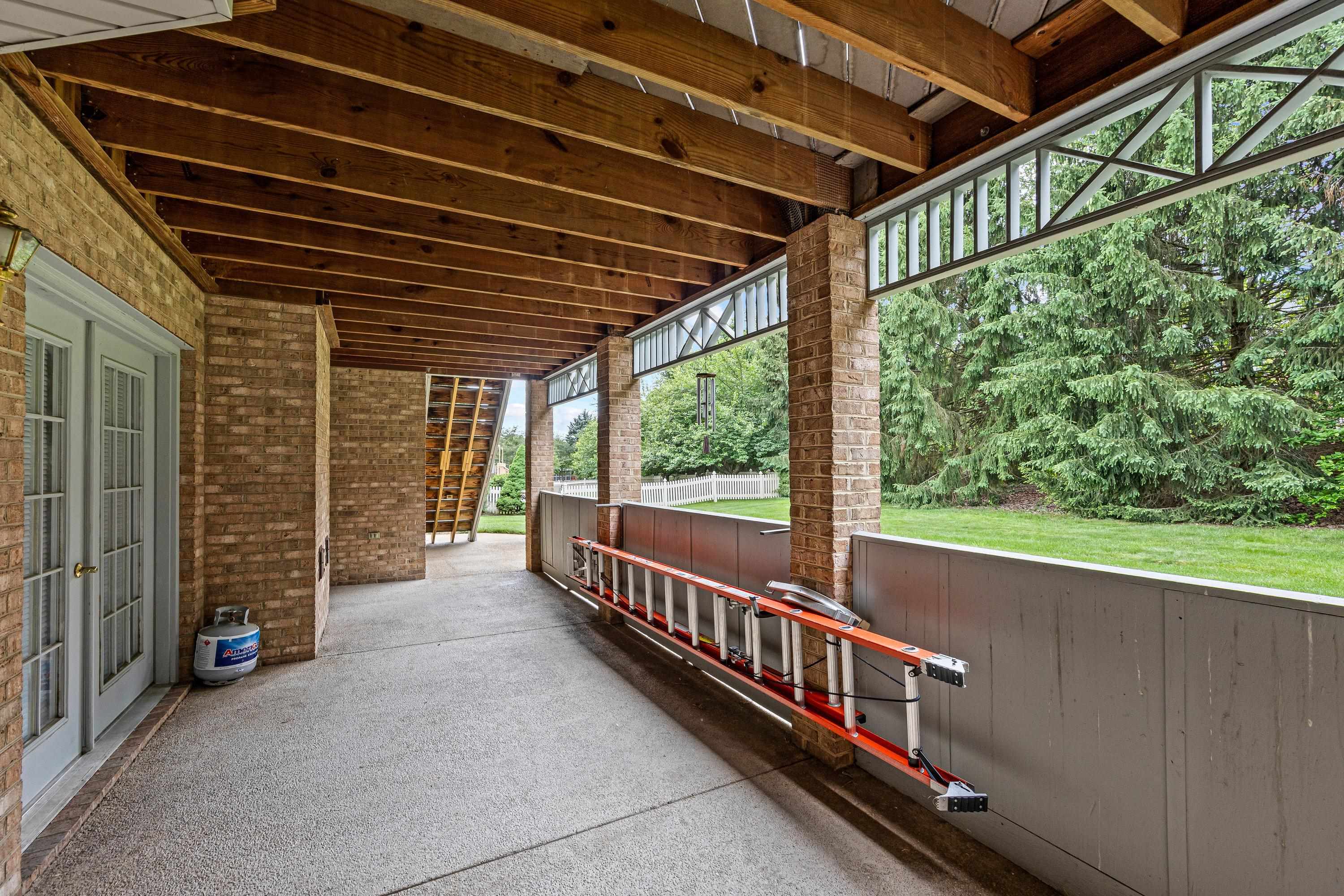 The lower level offers a concrete patio off of the basement space.  This patio offers storage/entertainment options for the backyard.