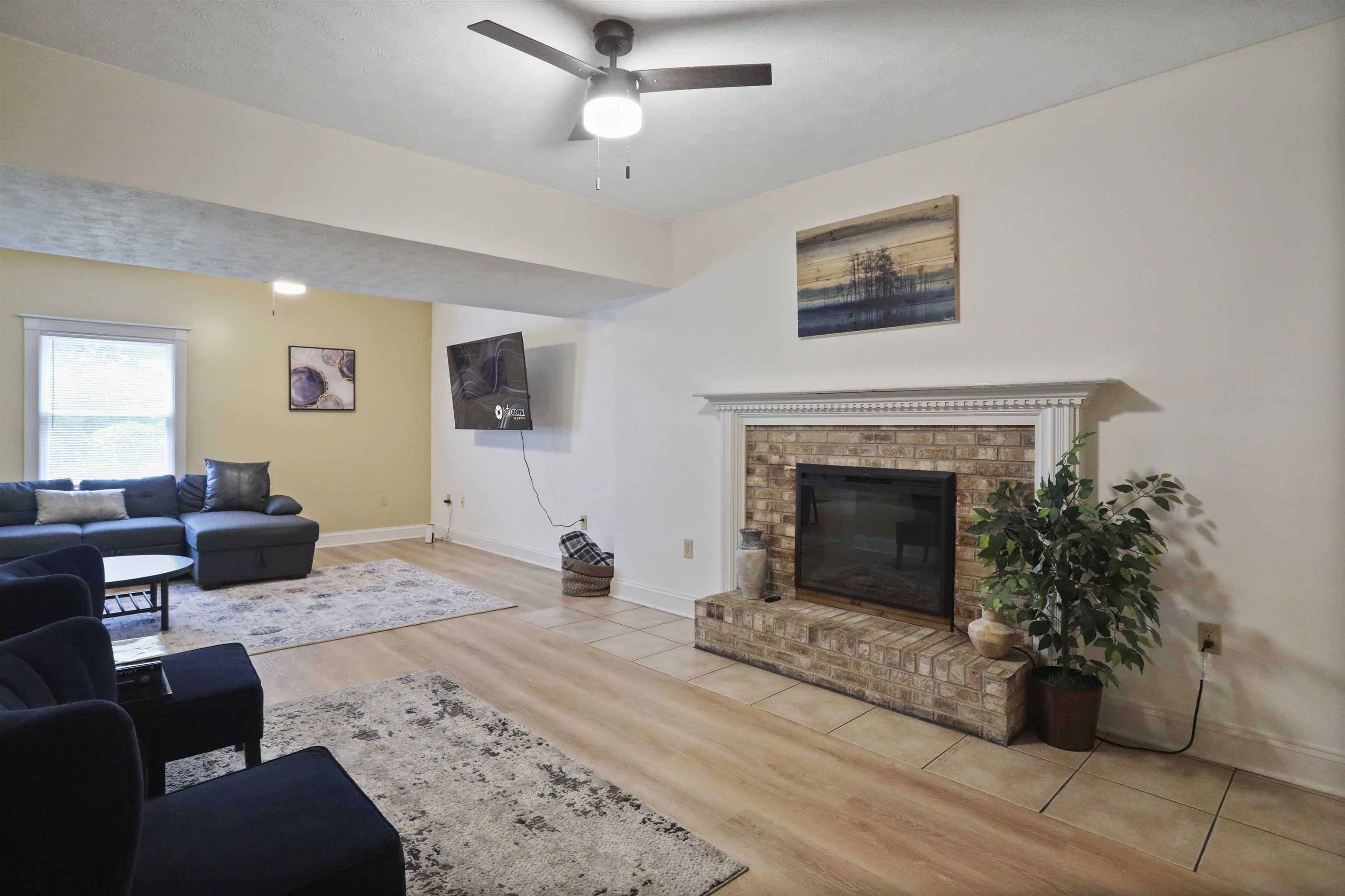 1st room as you walk downstairs, Family Room with a fireplace