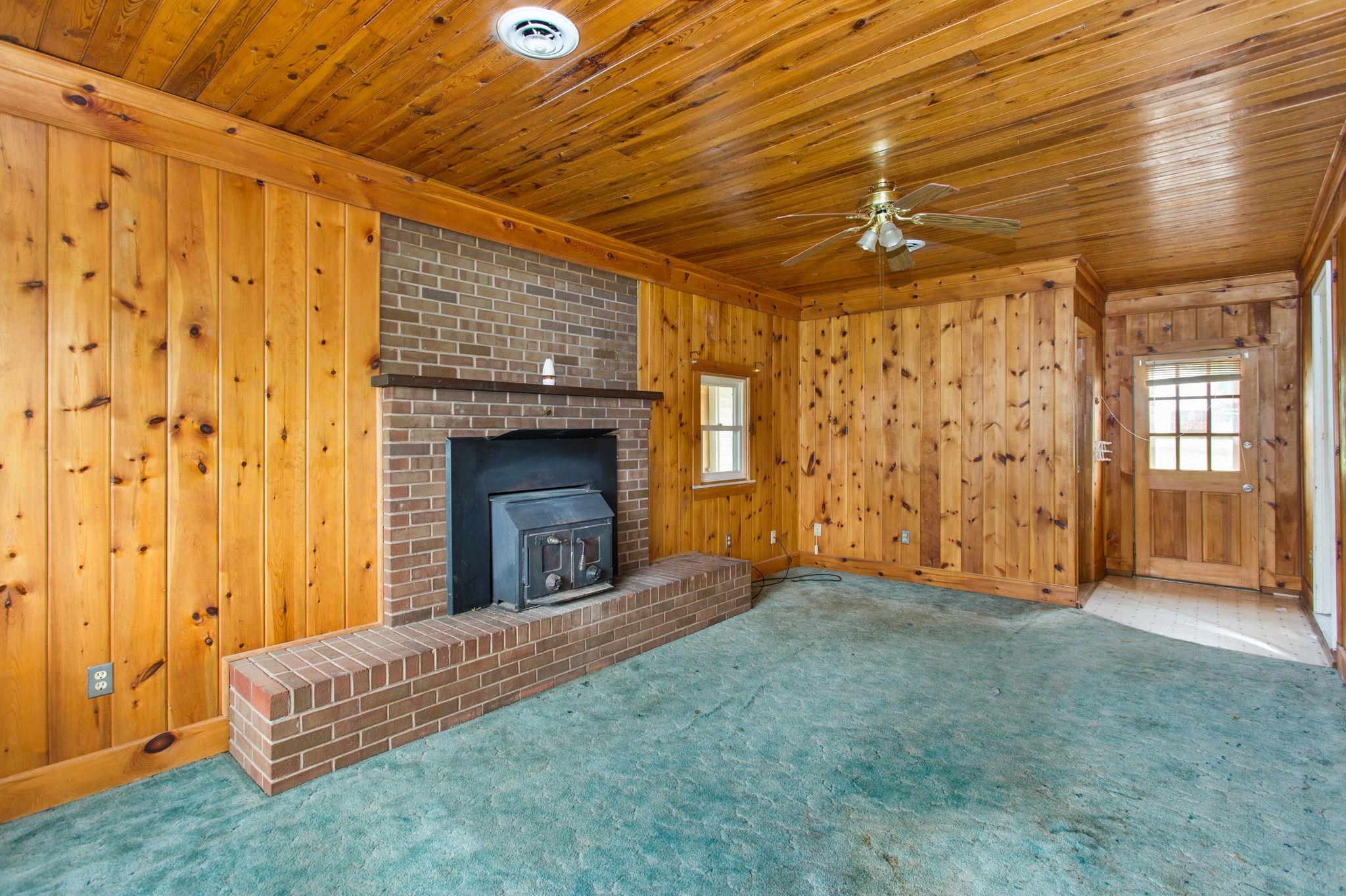 off the kitchen with wood stove insert.