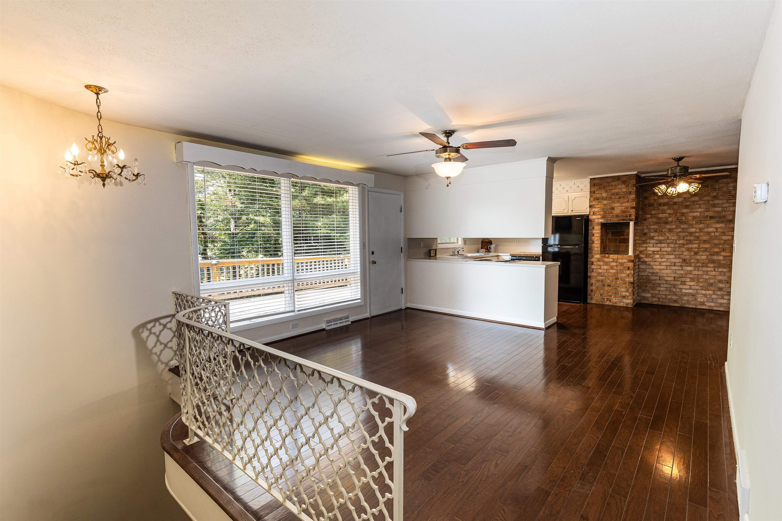 Large family room overlooking deck and open area to kitchen