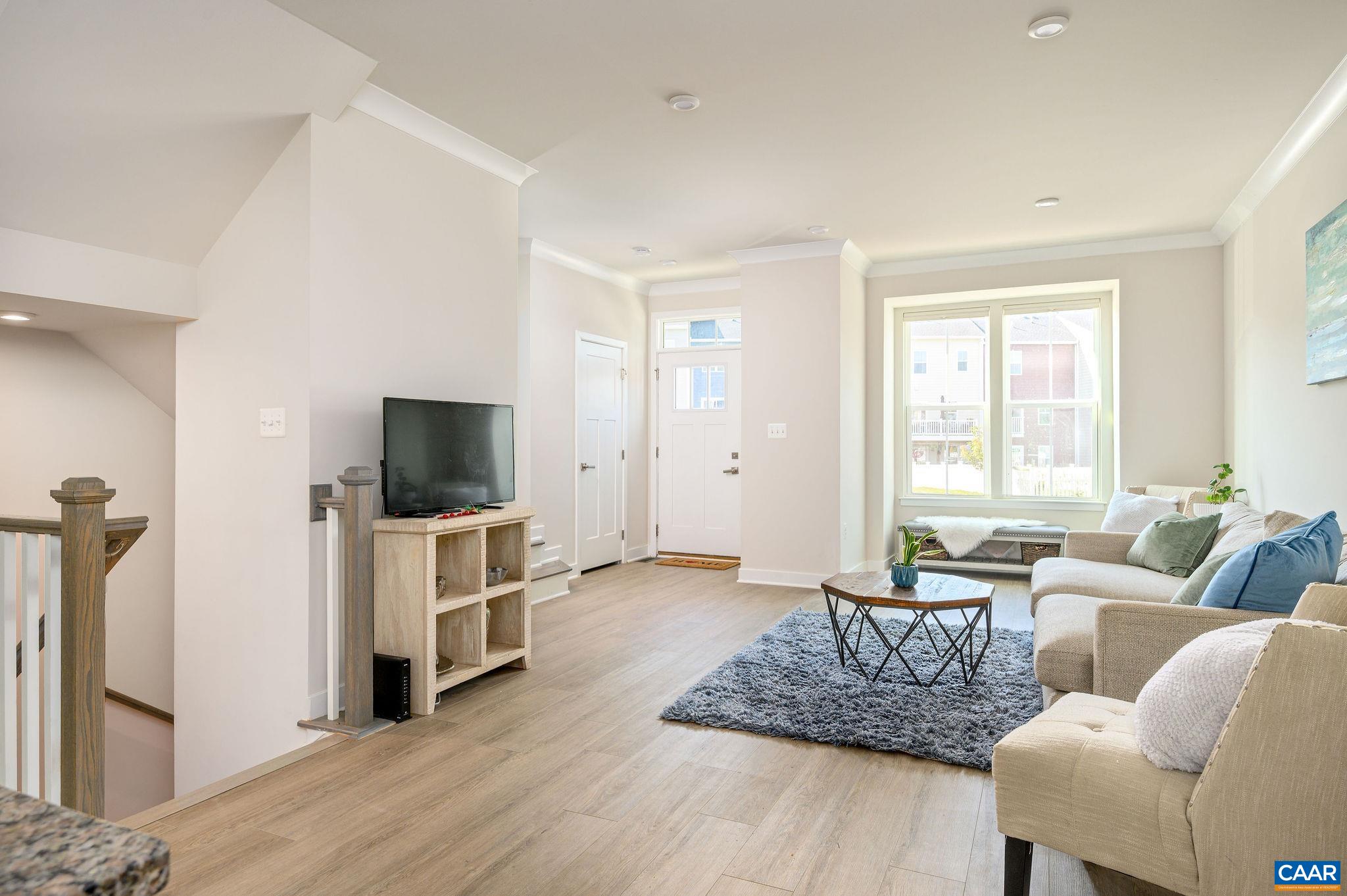 Extra recessed lighting, double windows and transom above door